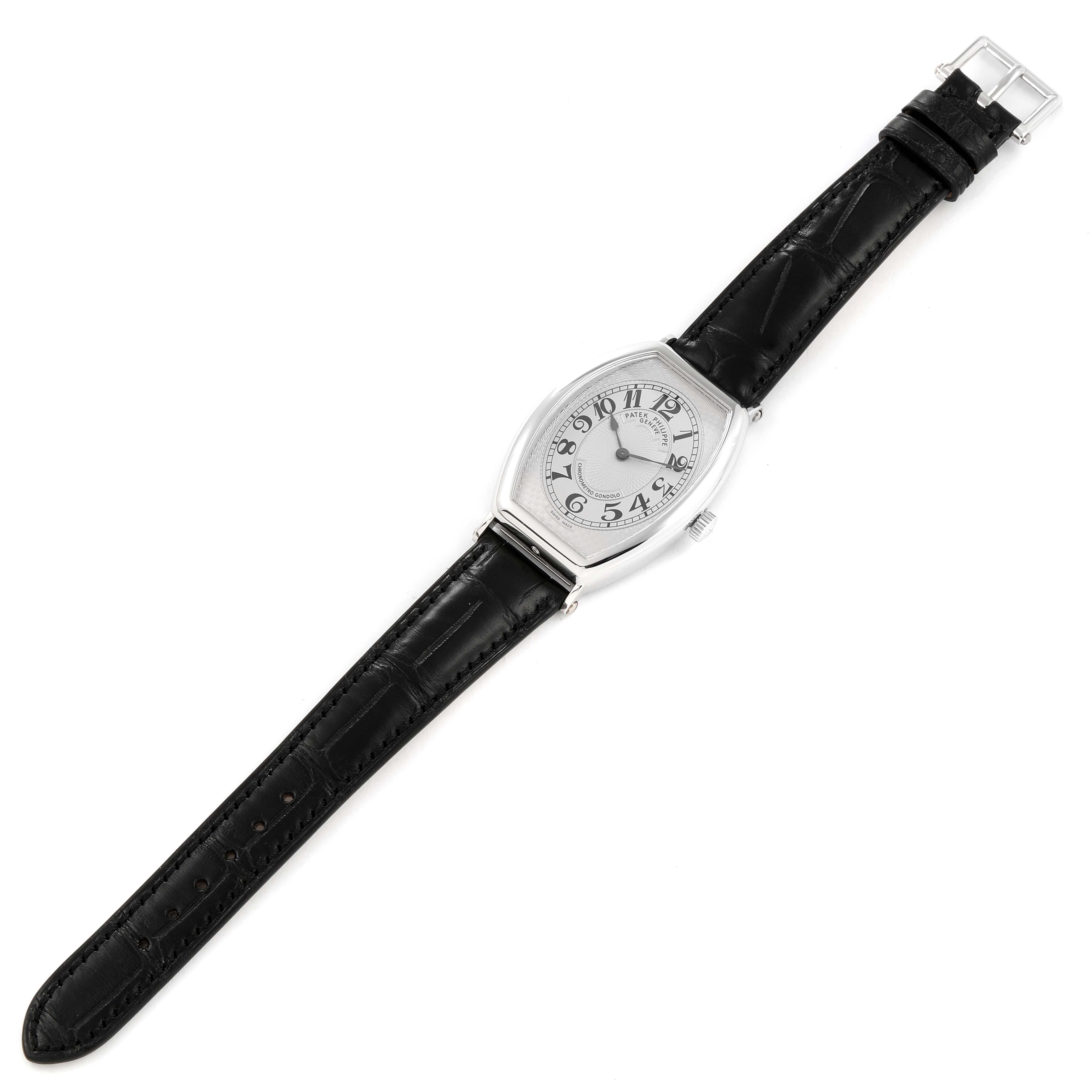 The image shows a top view of a Patek Philippe Gondolo 5098P Men's Platinum Silver Dial 5098P Men's Platinum Silver Dial watch with a black leather strap and silver dial.