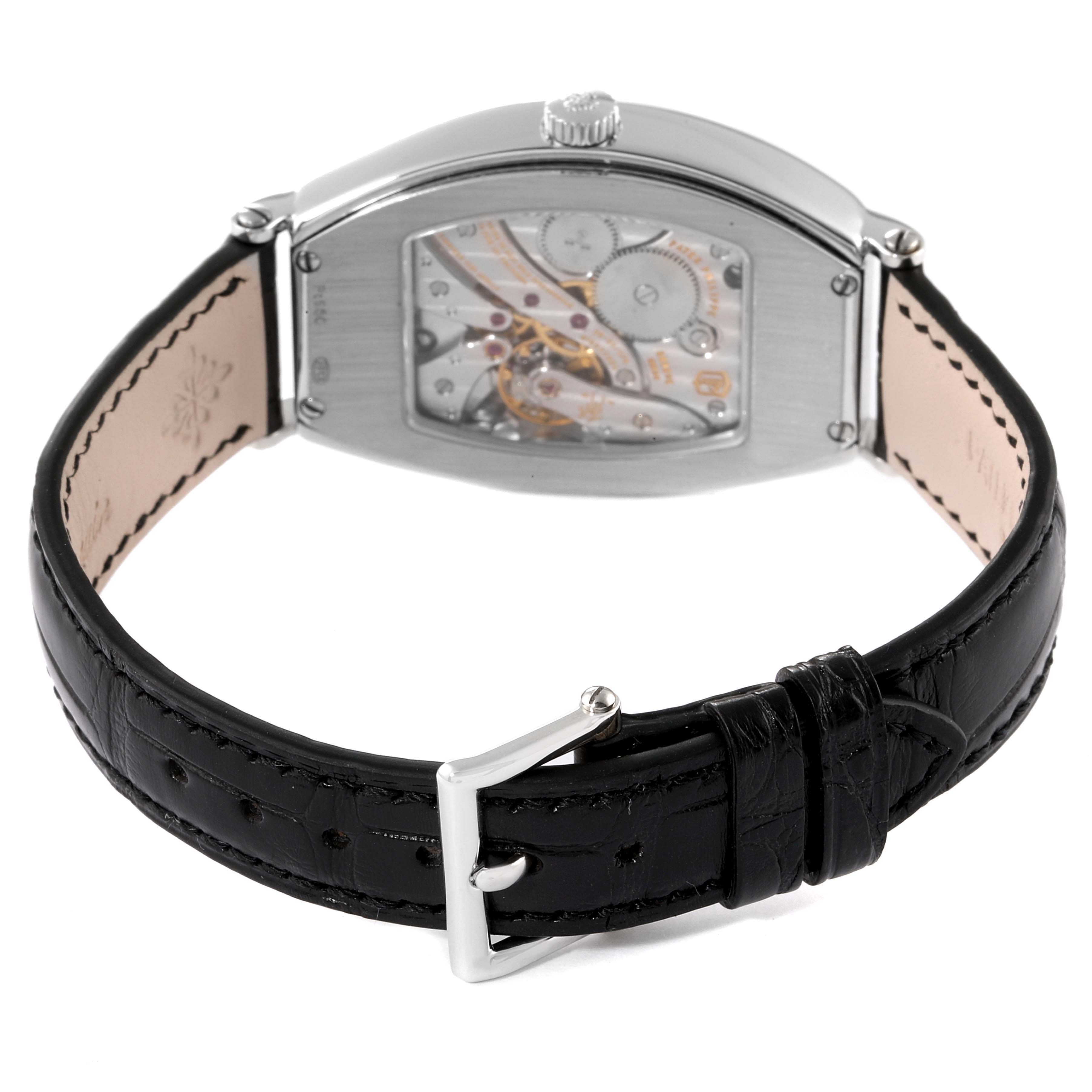 The image shows a rear angle of the Patek Philippe Gondolo 5098P Men's Platinum Silver Dial 5098P Men's Platinum Silver Dial watch, highlighting the exposed movement and black leather strap with buckle.