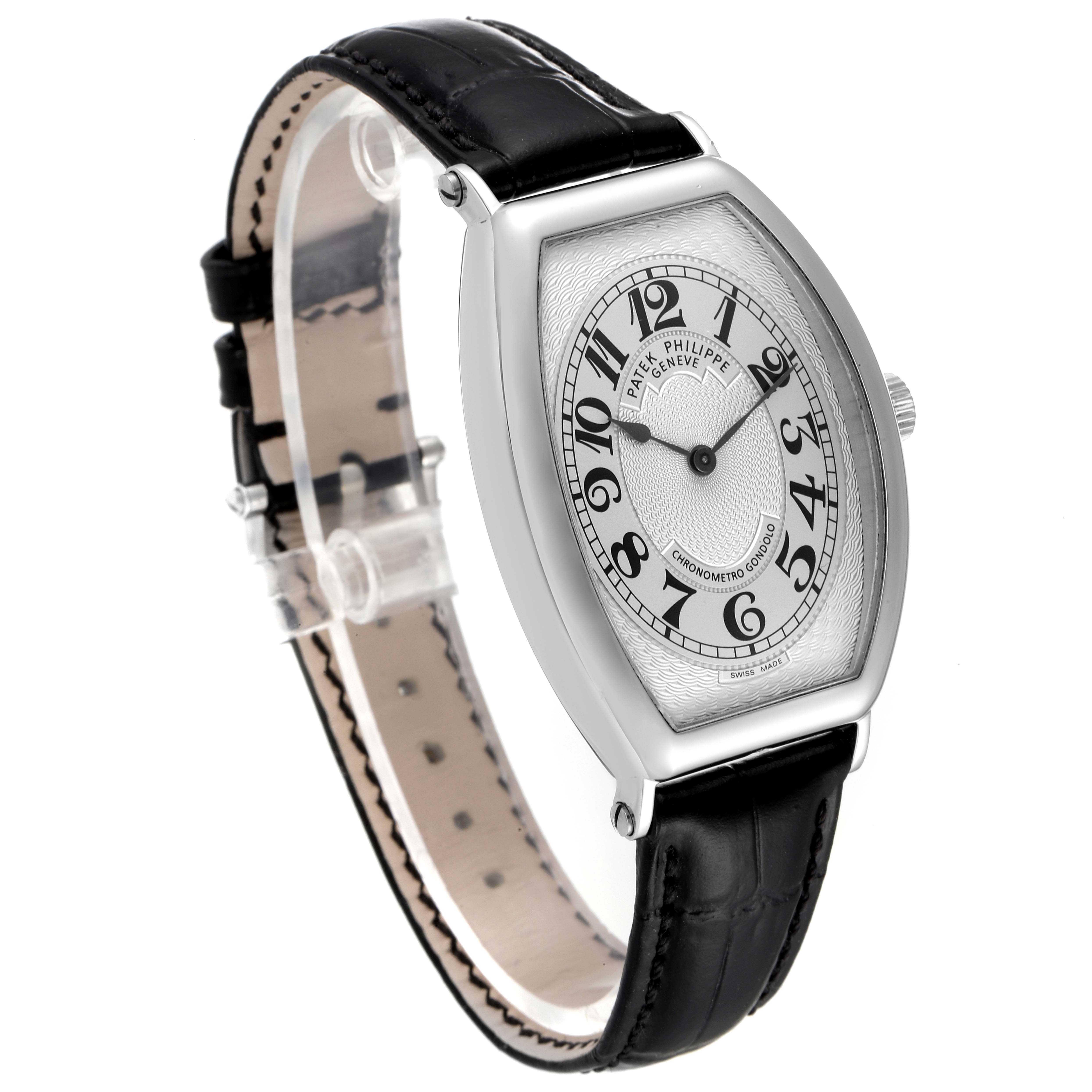 The Patek Philippe Gondolo 5098P Men
s Platinum Silver Dial 5098P Men
s Platinum Silver Dial watch is shown at an angled side view, displaying its dial, case, and black leather strap.