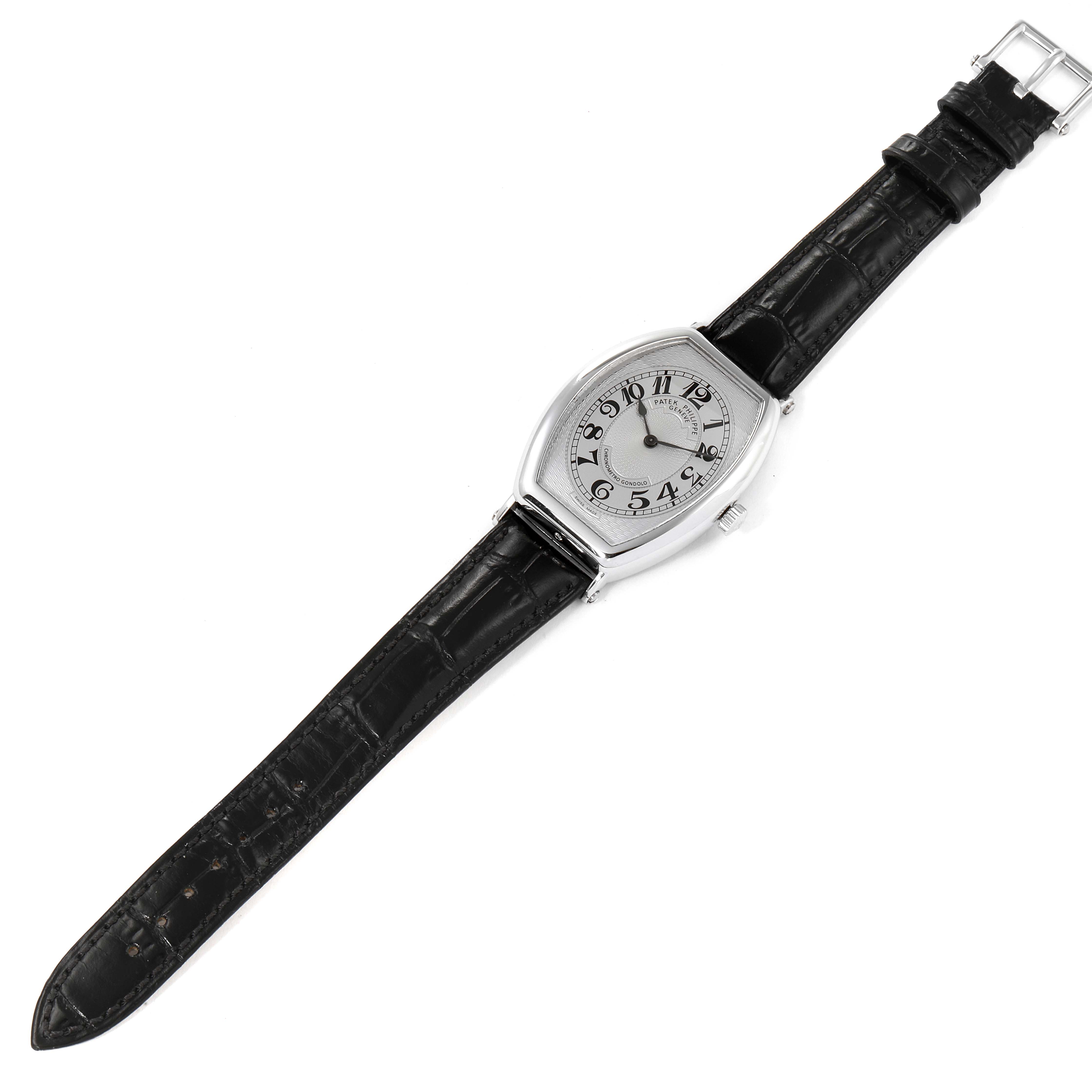 The Patek Philippe Gondolo 5098P Men
s Platinum Silver Dial 5098P Men
s Platinum Silver Dial watch is shown from a top-down angle, displaying its face and black leather strap.