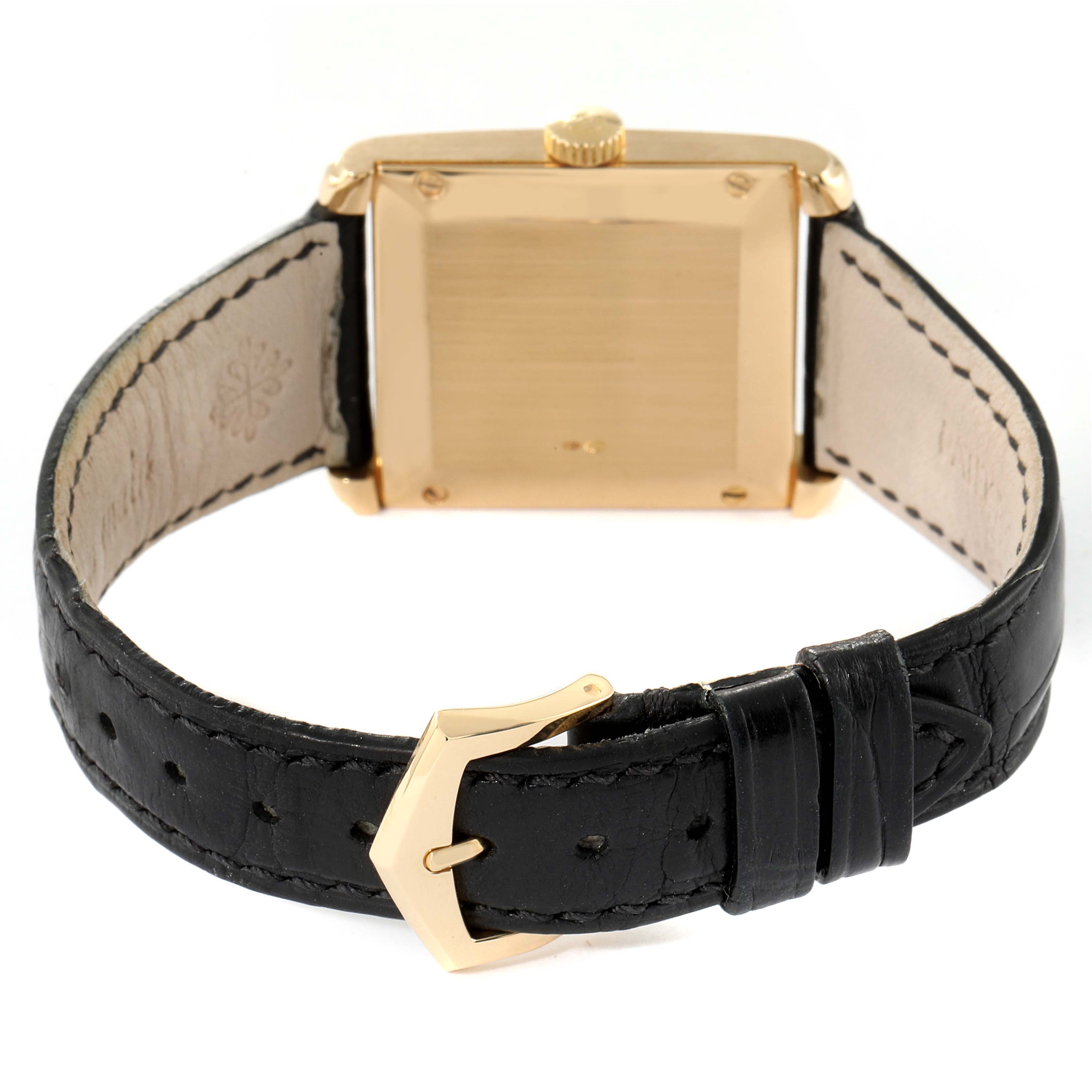 This image shows the back of the Patek Philippe Gondolo 5014J Men's Yellow Gold Silver Dial 5014J Men's Yellow Gold Silver Dial watch and its black leather strap with a gold buckle.