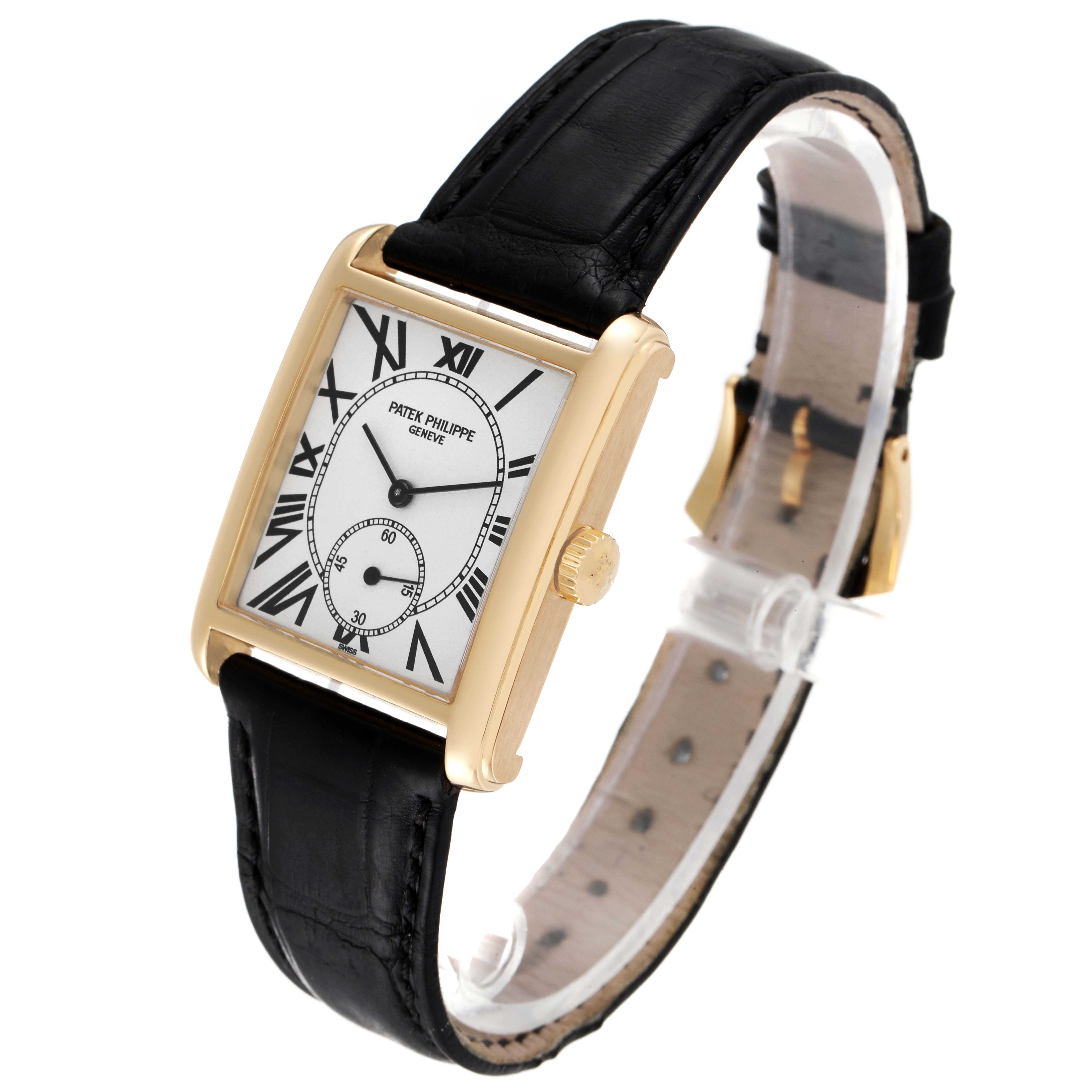 This image shows a Patek Philippe Gondolo 5014J Men's Yellow Gold Silver Dial 5014J Men's Yellow Gold Silver Dial watch from an angled side view, displaying its square dial, black leather strap, and golden case.