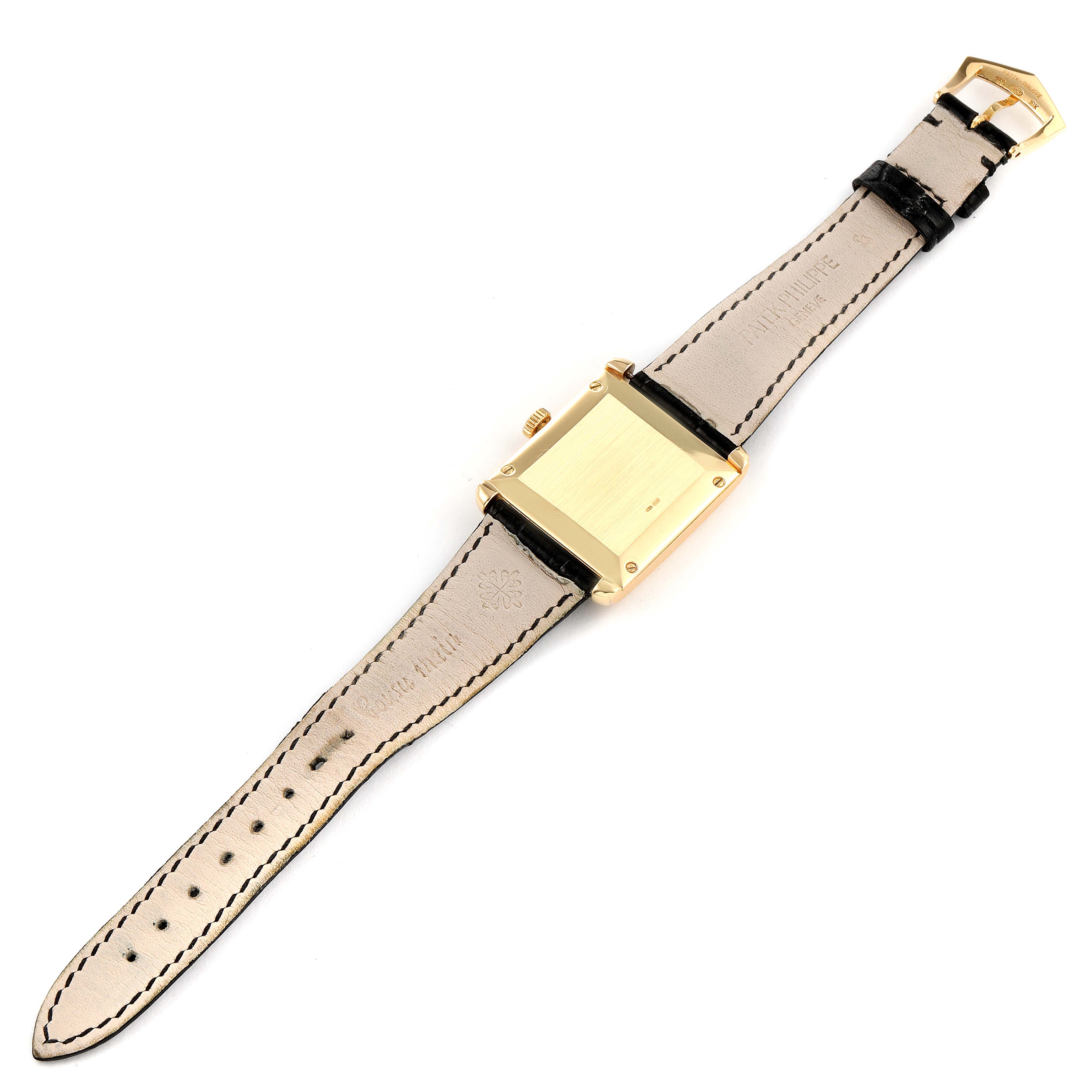 The image shows the back of the Patek Philippe Gondolo 5014J Men's Yellow Gold Silver Dial 5014J Men's Yellow Gold Silver Dial watch, displaying the case, crown, and leather straps.