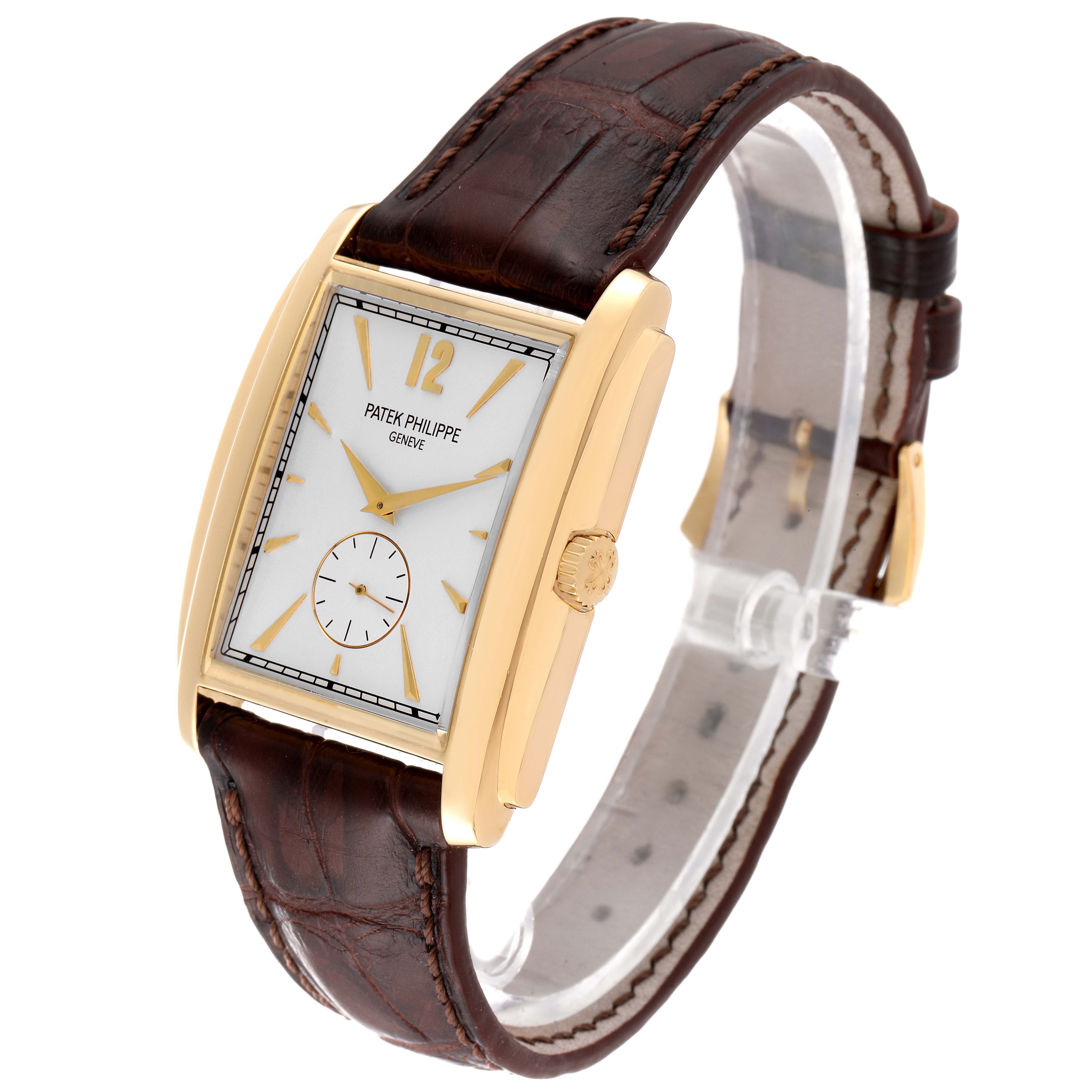 The image shows a Patek Philippe Gondolo 5124J Men's Yellow Gold Silver Dial 5124J Men's Yellow Gold Silver Dial watch from a three-quarter angle, displaying the dial, case, strap, and crown.