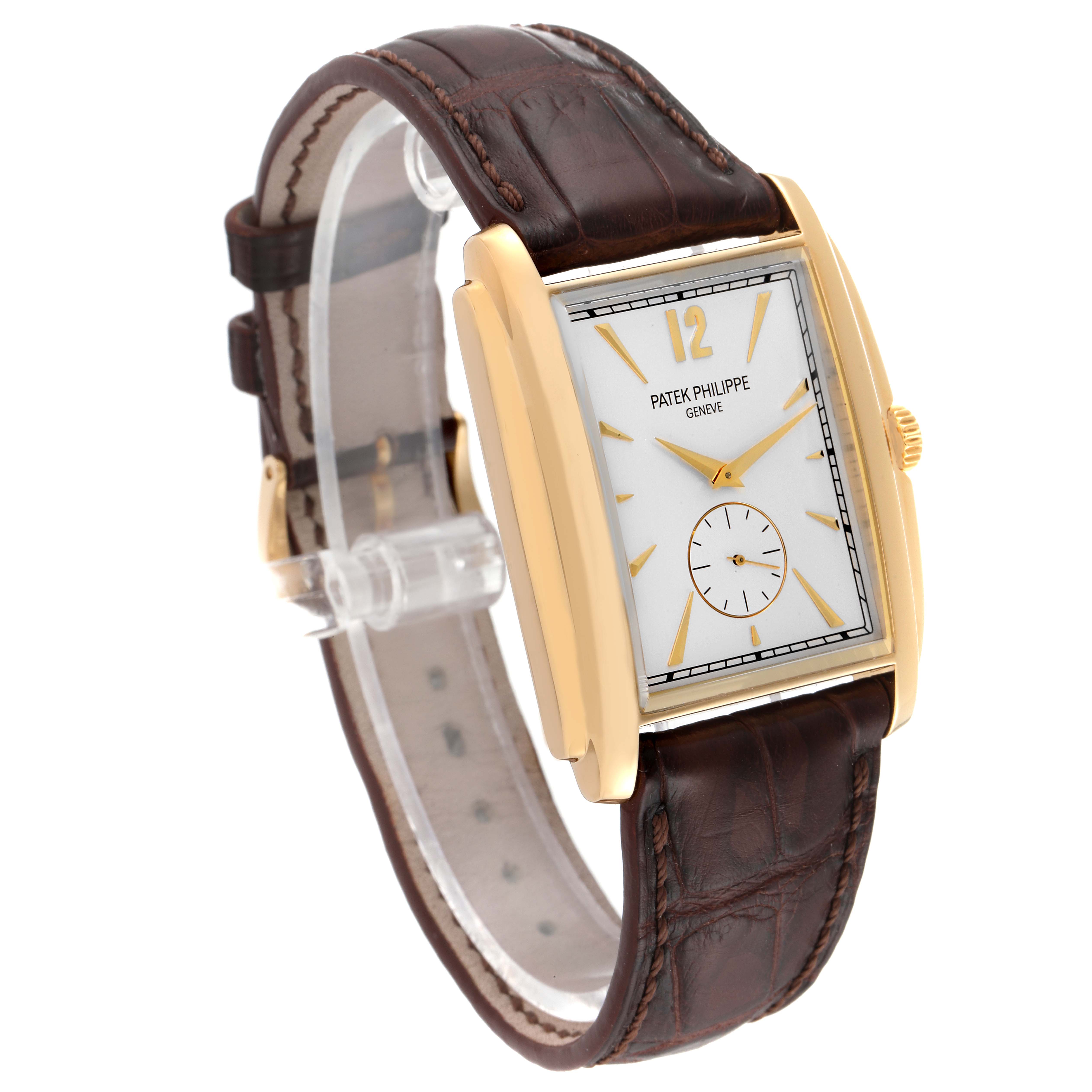 The image shows a side angle view of the Patek Philippe Gondolo 5124J Men's Yellow Gold Silver Dial 5124J Men's Yellow Gold Silver Dial watch, highlighting its rectangular dial and brown leather strap.
