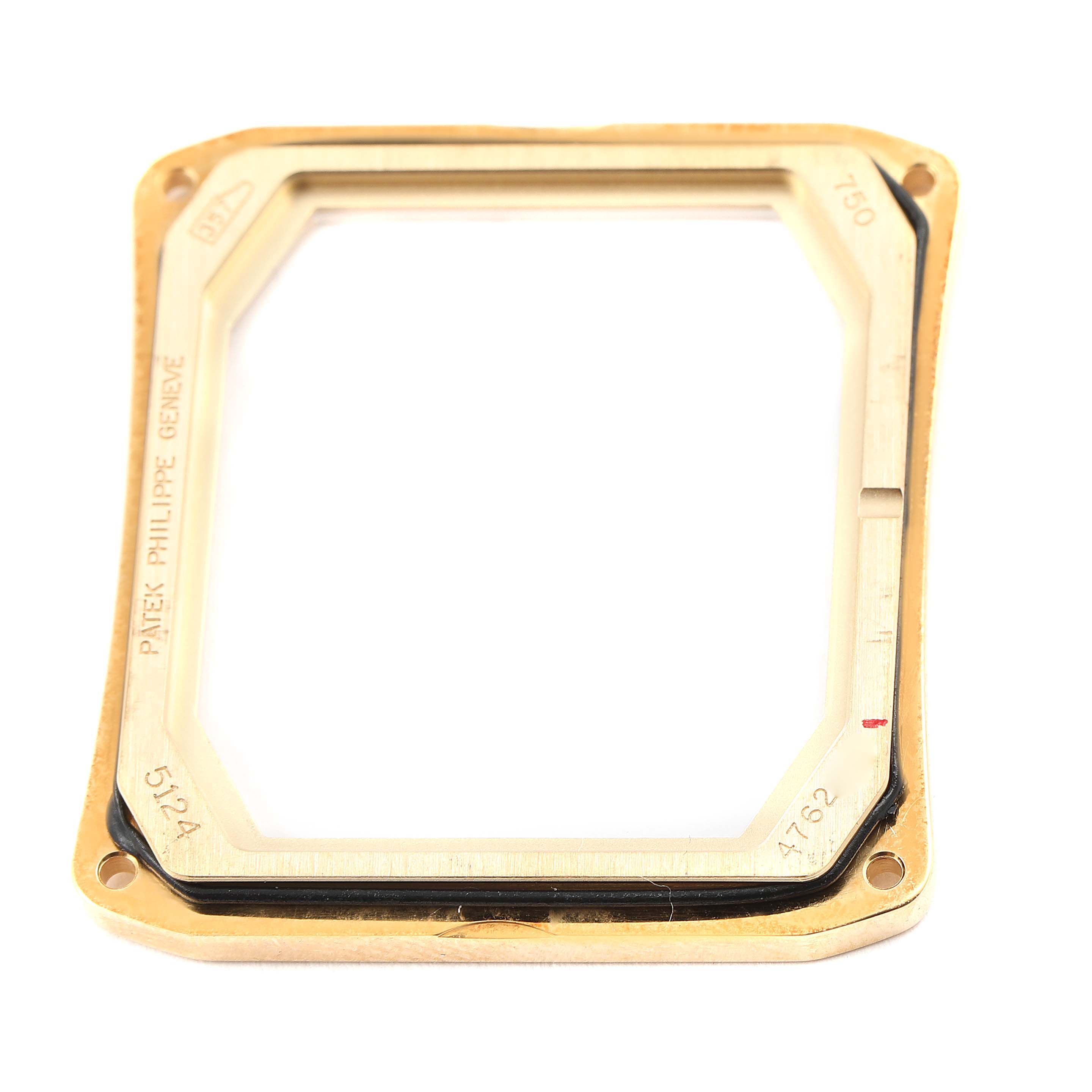 This image shows a close-up of the rectangular bezel part of the Patek Philippe Gondolo 5124J Men's Yellow Gold Silver Dial 5124J Men's Yellow Gold Silver Dial watch.