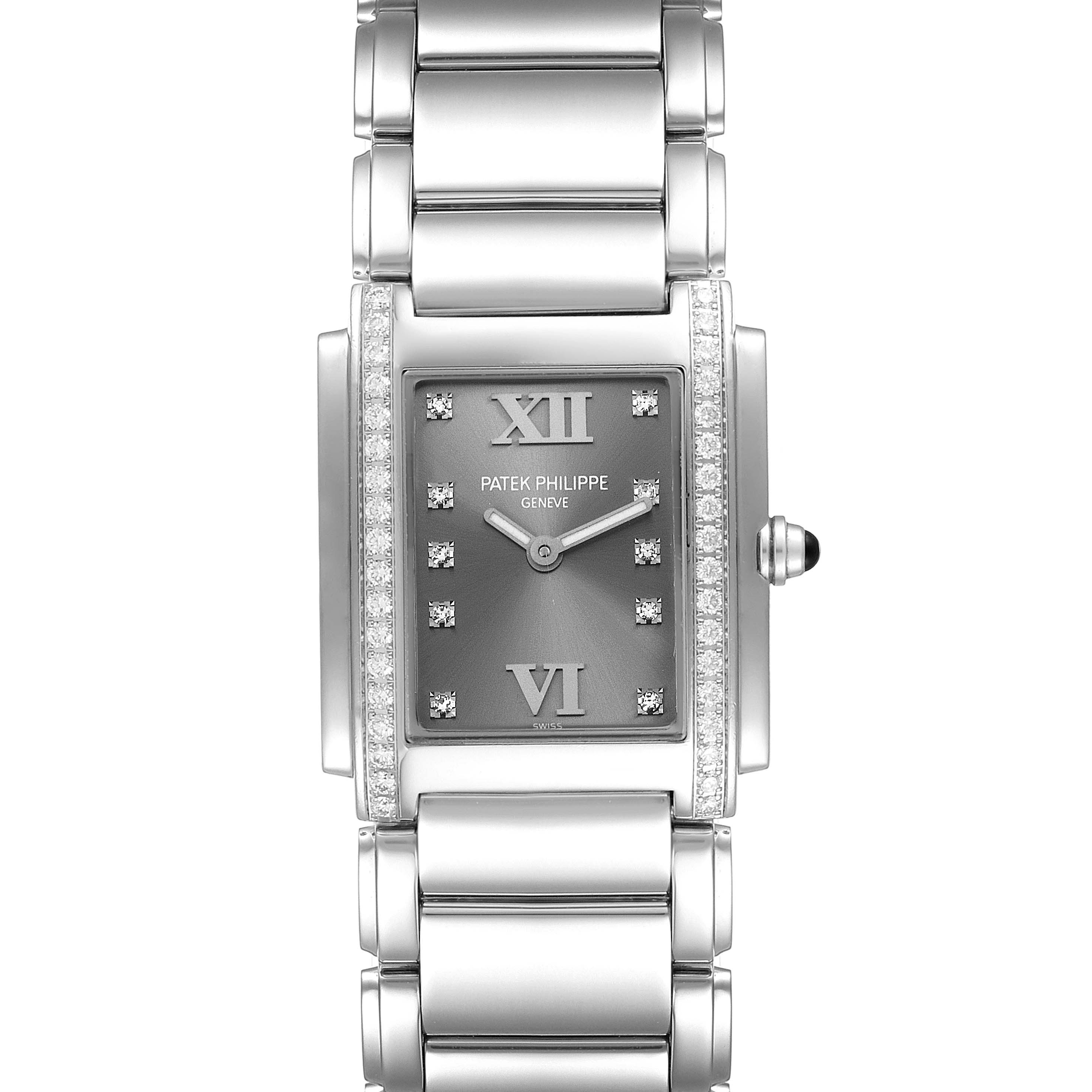 The image shows the front view of the Patek Philippe Twenty-4 4910/10A-010 Women's Stainless Steel Grey Dial 4910/10A-010 Women's Stainless Steel Grey Dial model, displaying its rectangular face, bracelet, and diamond detailing.