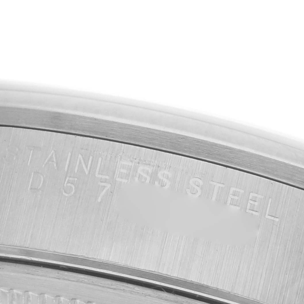 The image shows a close-up of the engraved stainless steel part on the back of a Rolex Date 15200 Men
s Stainless Steel Blue Dial 15200 Men
s Stainless Steel Blue Dial model.