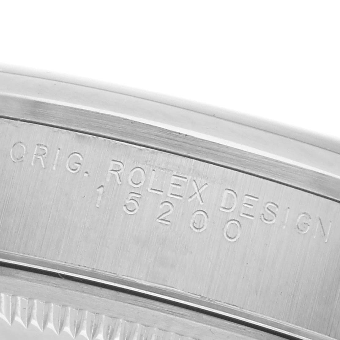 The image shows the side engraving of the case on a Rolex Date 15200 Men
s Stainless Steel Blue Dial 15200 Men
s Stainless Steel Blue Dial model, focusing on the "ORIG. ROLEX DESIGN" and model number.