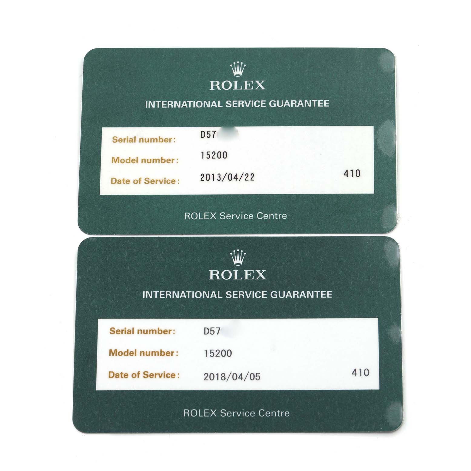 The image shows two Rolex International Service Guarantee cards for the Date model, viewed from above.