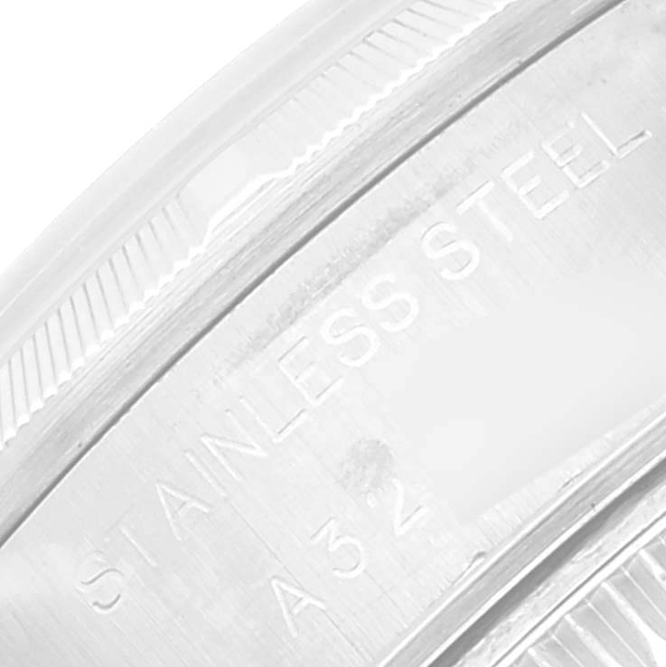 The image shows a close-up of the side engraving on the stainless steel case of a Rolex Datejust 69190 Women's Stainless Steel Silver Dial 69190 Women's Stainless Steel Silver Dial watch.