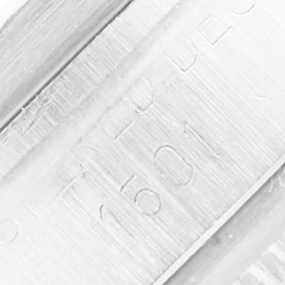 The image shows a close-up of the case side of the Rolex Vintage Collection 1501 Men's Stainless Steel Silver Dial 1501 Men's Stainless Steel Silver Dial watch, specifically focusing on the engraved serial number.