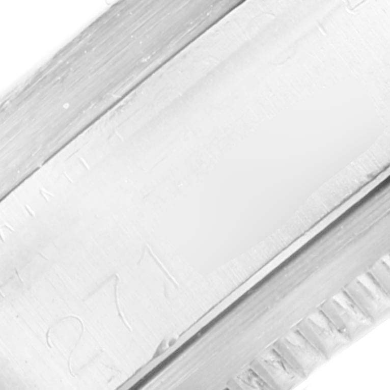 This image shows a close-up of the side and bezel of the Rolex Vintage Collection 1501 Men's Stainless Steel Silver Dial 1501 Men's Stainless Steel Silver Dial watch.