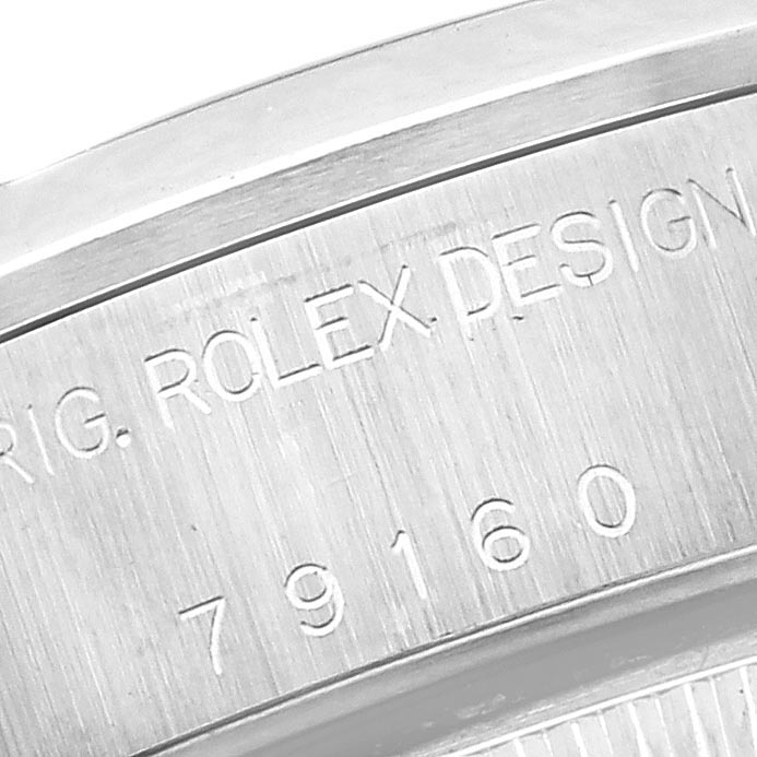 The image shows a close-up of the serial number engraved on the side of a Rolex Date 79160 Women's Stainless Steel White Dial 79160 Women's Stainless Steel White Dial model watch case.