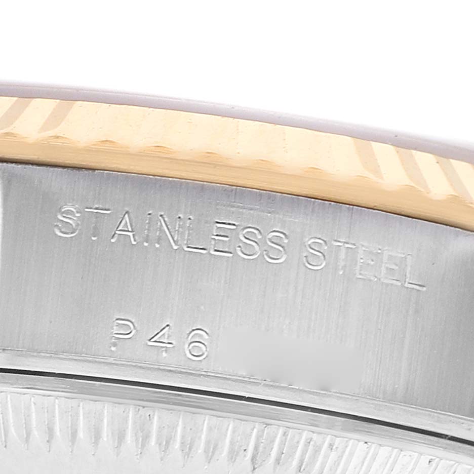 The image shows a close-up of the side of a Rolex Datejust 79173 Women's Steel and Gold (two tone) Mother of Pearl Dial watch, focusing on the stainless steel case and part of the fluted bezel.