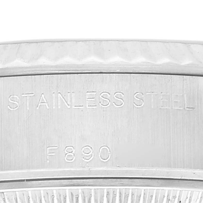 The image shows a close-up of the stainless steel engraving on the case back of a Rolex Datejust 79174 Women's Stainless Steel White Dial 79174 Women's Stainless Steel White Dial watch.