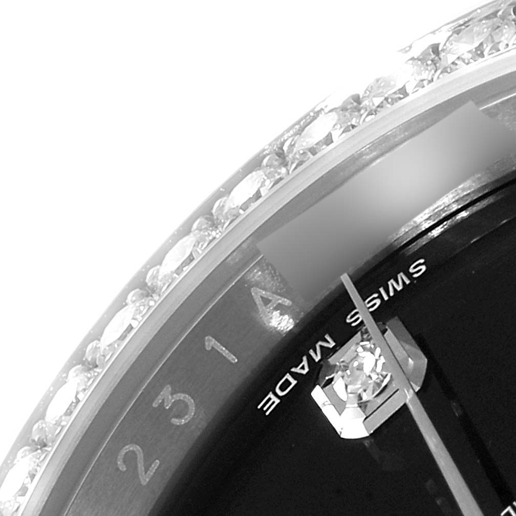 This image shows a close-up of the Rolex Datejust 116244 Men
s Stainless Steel Black Dial 116244 Men
s Stainless Steel Black Dial watch face, including part of the dial, bezel with diamonds, and the "SWISS MADE" text.