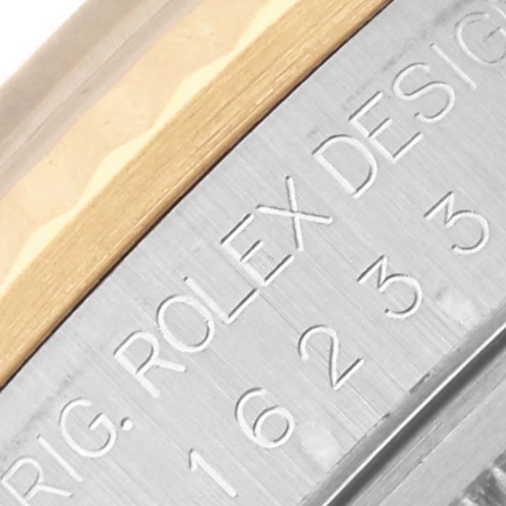 The image shows a close-up of the case side engraving on a Rolex Datejust 16233 Men's Steel and Gold (two tone) Mother of Pearl Dial 16233 Men's Steel and Gold (two tone) Mother of Pearl Dial watch, highlighting its model number.