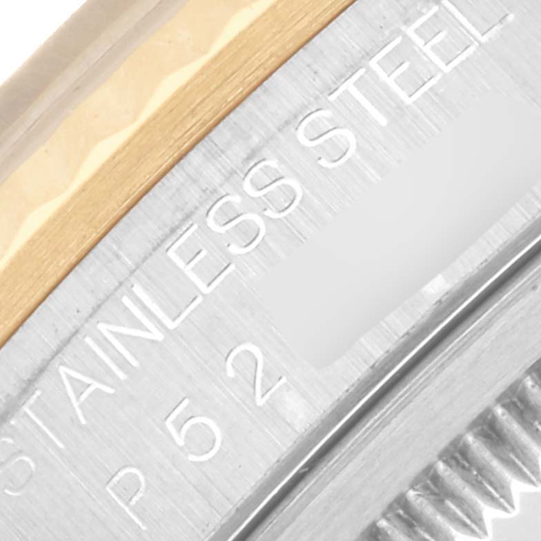 The image shows a close-up of the Rolex Datejust 16233 Men's Steel and Gold (two tone) Mother of Pearl Dial 16233 Men's Steel and Gold (two tone) Mother of Pearl Dial's bezel area with "STAINLESS STEEL" engraved.