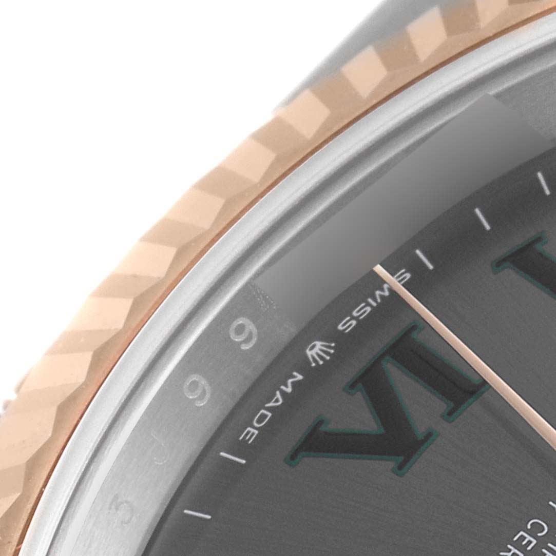 The image shows a close-up of the Rolex Datejust 41 126331 Men's Steel and Gold (two tone) Grey Dial 126331 Men's Steel and Gold (two tone) Grey Dial model, focusing on part of the bezel, dial, and Roman numeral markings.