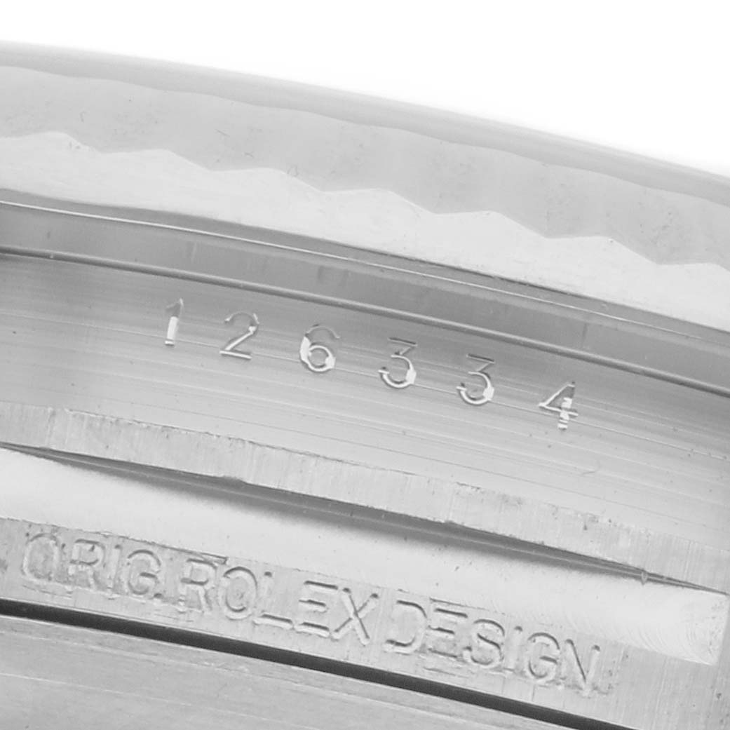 The image shows a detailed close-up of the inner bezel and engraved serial number of a Rolex Datejust 41 126334 Men's Stainless Steel Blue Dial 126334 Men's Stainless Steel Blue Dial watch.