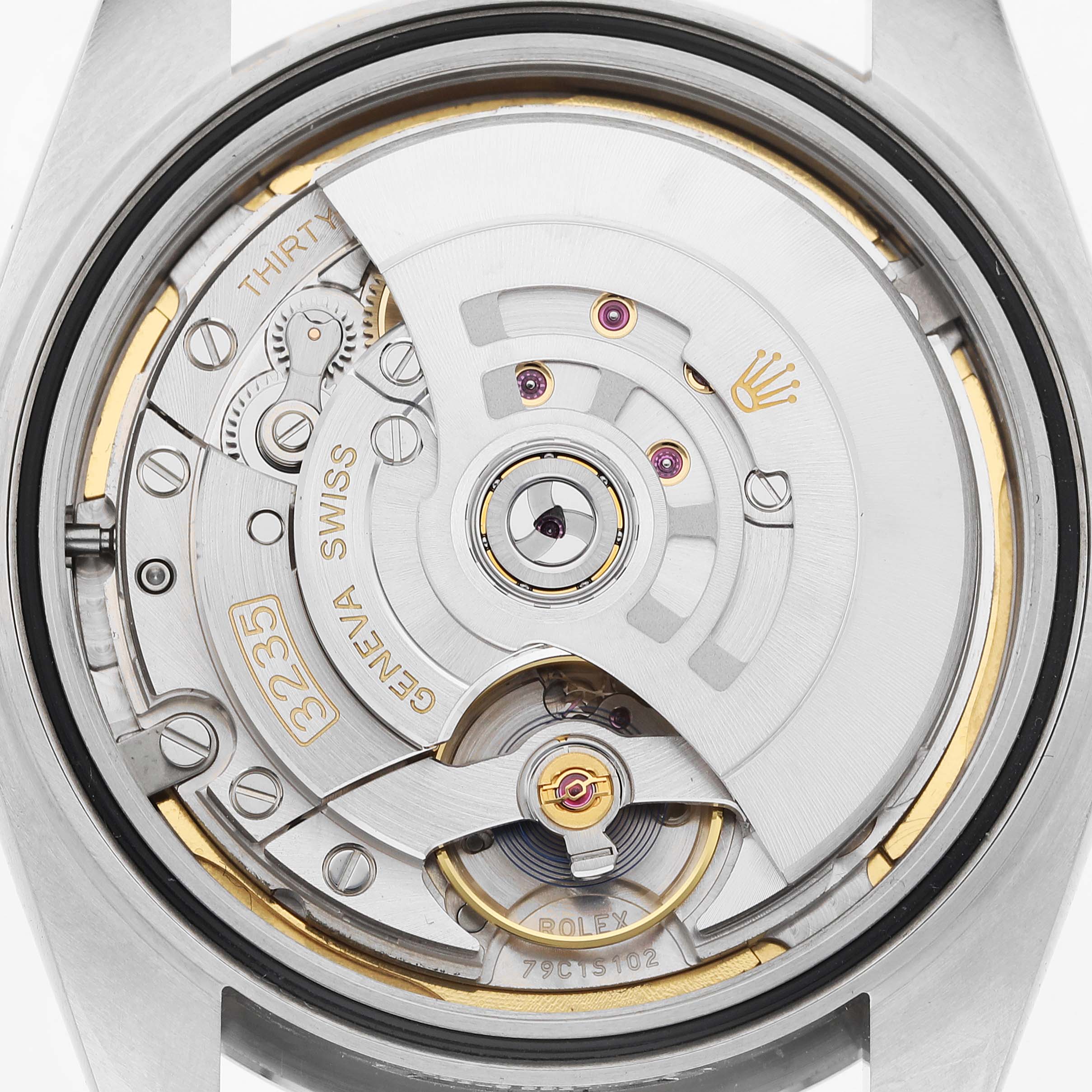 The image shows the back view of a Rolex Datejust 41 126334 Men's Stainless Steel Blue Dial, highlighting its movement and internal mechanisms.