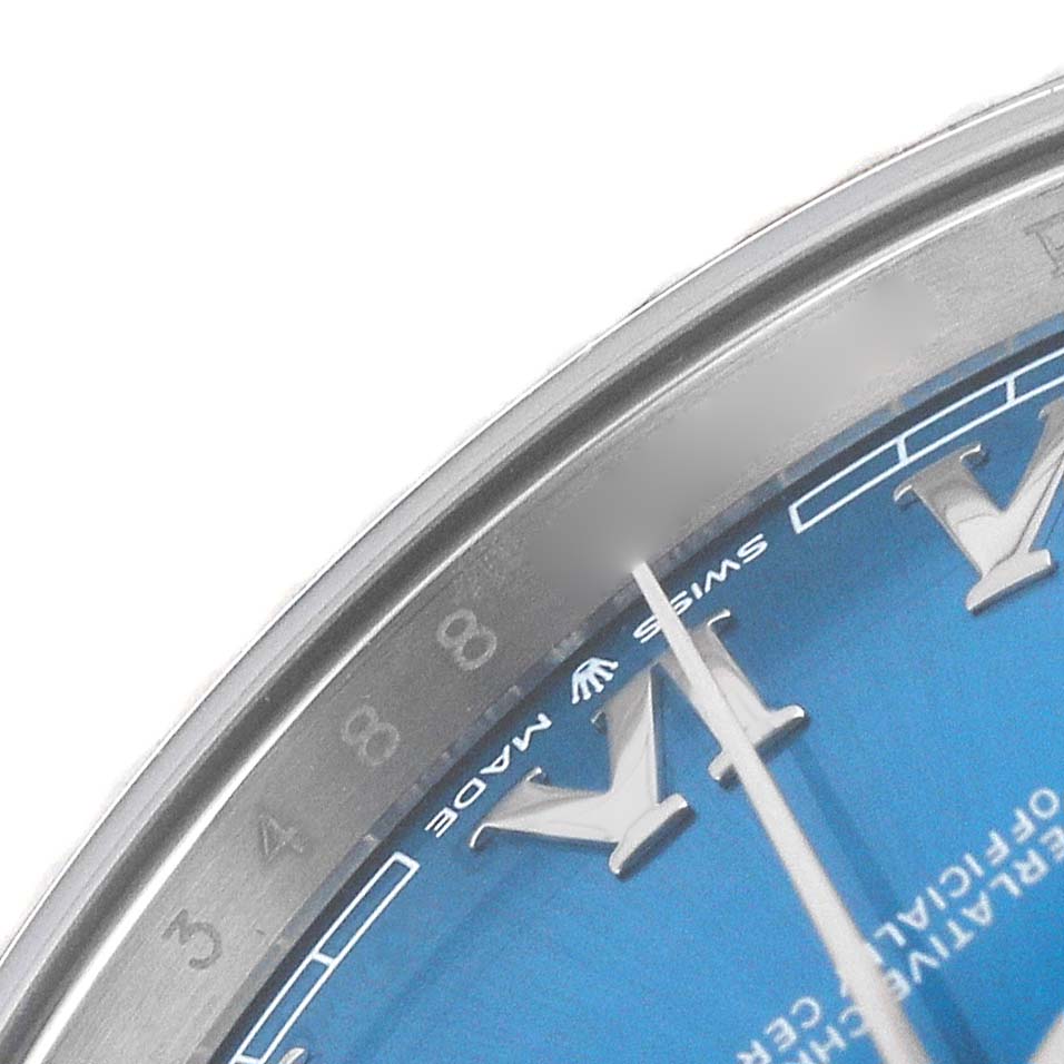 The image shows a close-up of the dial and bezel of a Rolex Datejust 41 126334 Men's Stainless Steel Blue Dial, highlighting the blue face and roman numerals.