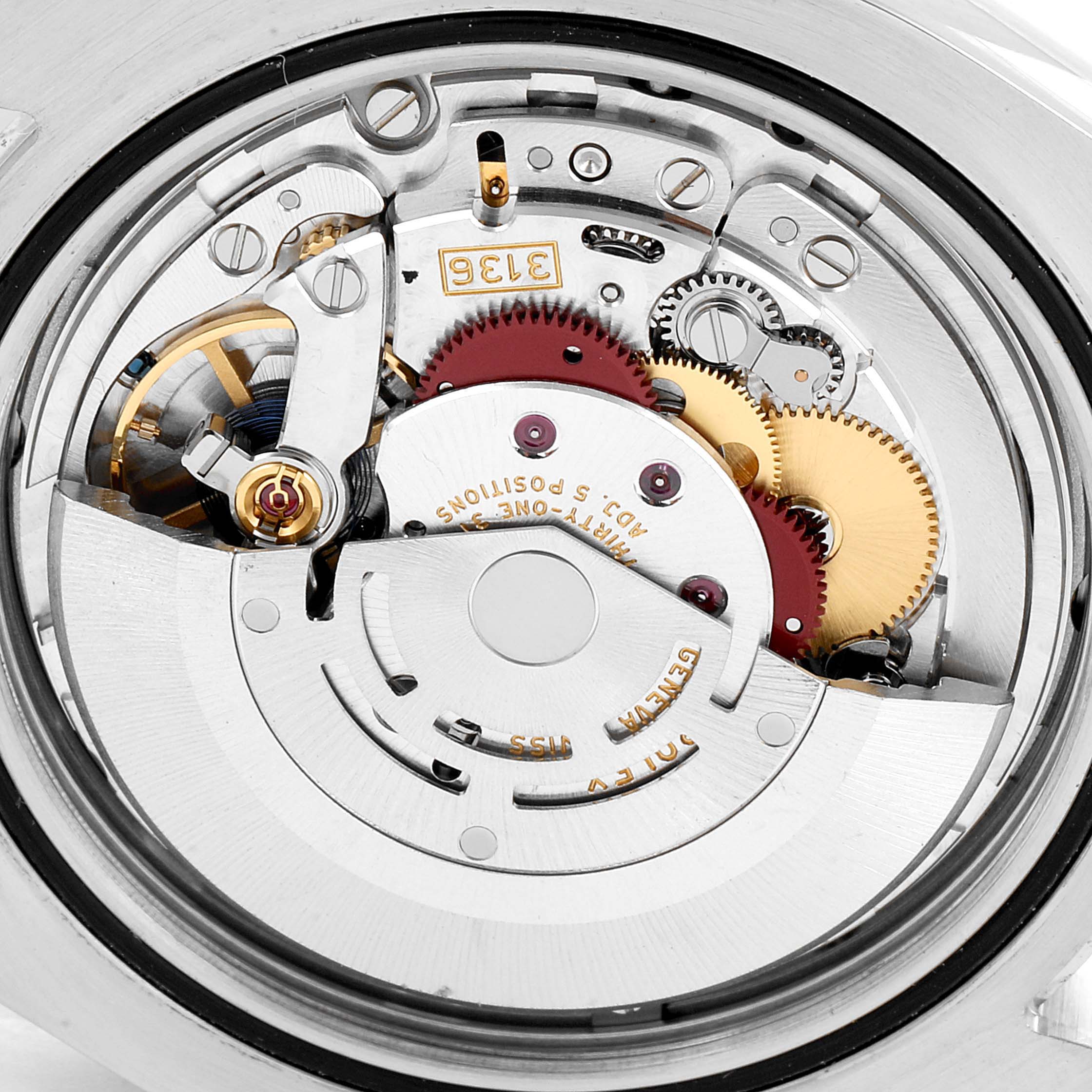 This image shows the intricate movement mechanism of a Rolex Datejust 41 116333 Men's Steel and Gold (two tone) Champagne Dial 116333 Men's Steel and Gold (two tone) Champagne Dial, including gears, rotors, and the balance wheel.