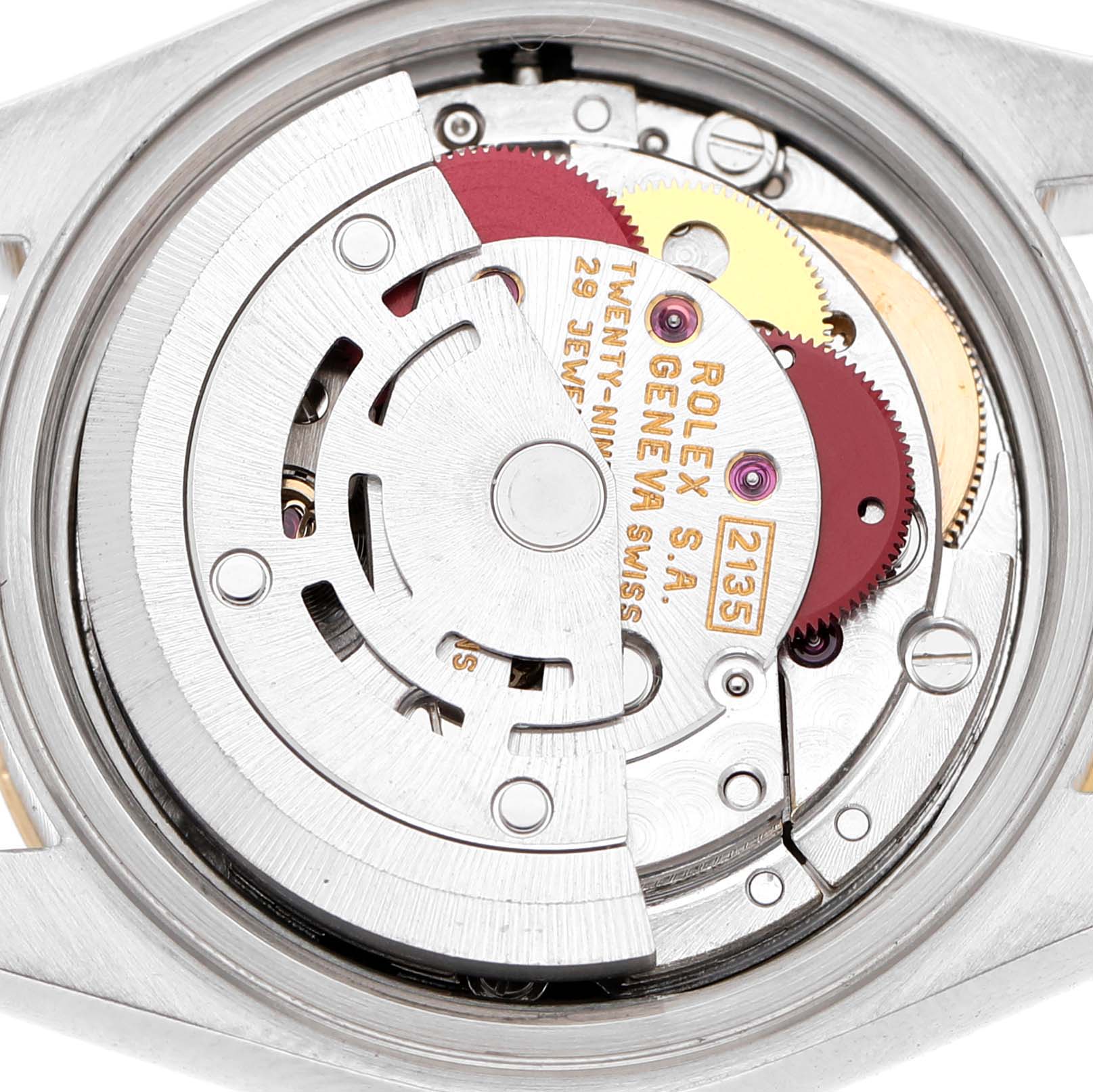 The image shows the intricate internal movement of a Rolex Datejust 69163 Women's Steel and Gold (two tone) Champagne Dial, viewed from the back.