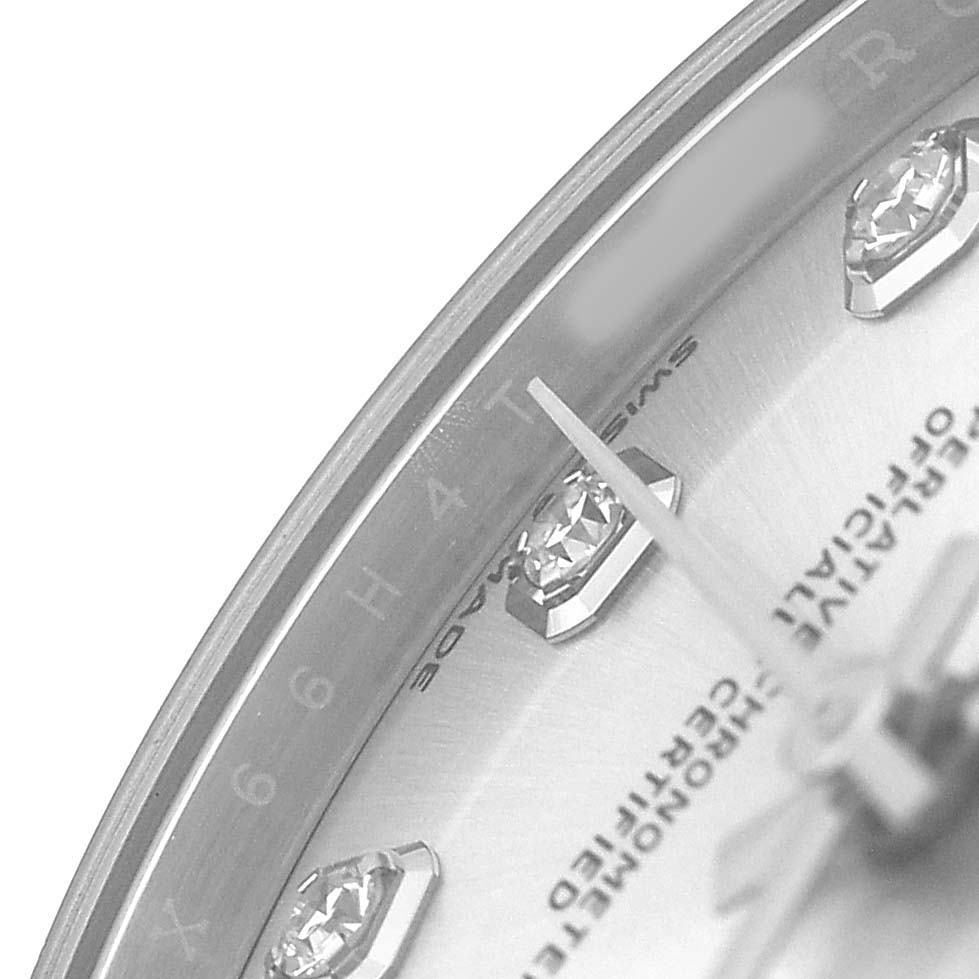 The image shows a close-up of the Rolex Datejust 278384RBR Women's Stainless Steel Silver Dial watch face, highlighting diamond hour markers and the bezel edge from an angled view.