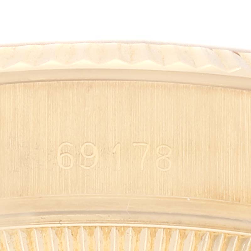 This close-up photo shows the model number "69178" on the case part of a Rolex President 69178 Women's Yellow Gold Champagne Dial 69178 Women's Yellow Gold Champagne Dial watch.
