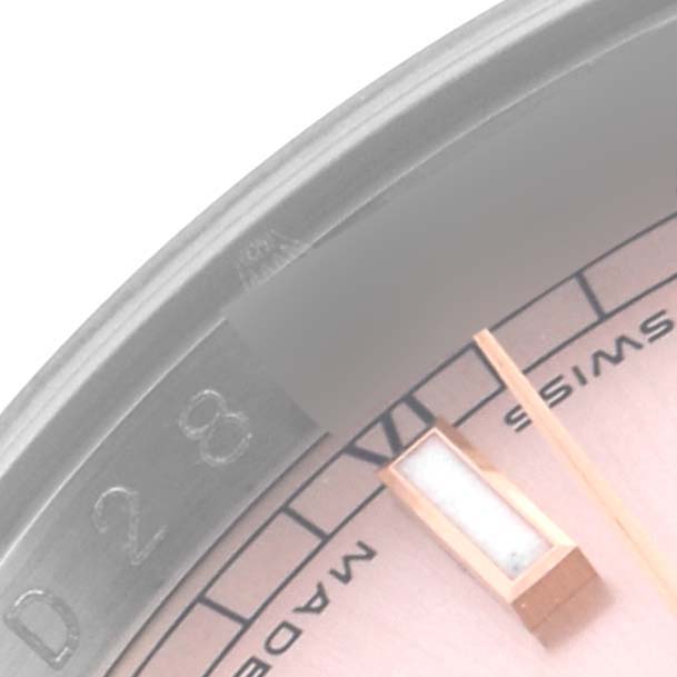 The image shows a close-up of the date section and part of the dial on a Rolex Datejust 116231 Men's Steel and Gold (two tone) Pink Dial 116231 Men's Steel and Gold (two tone) Pink Dial watch.