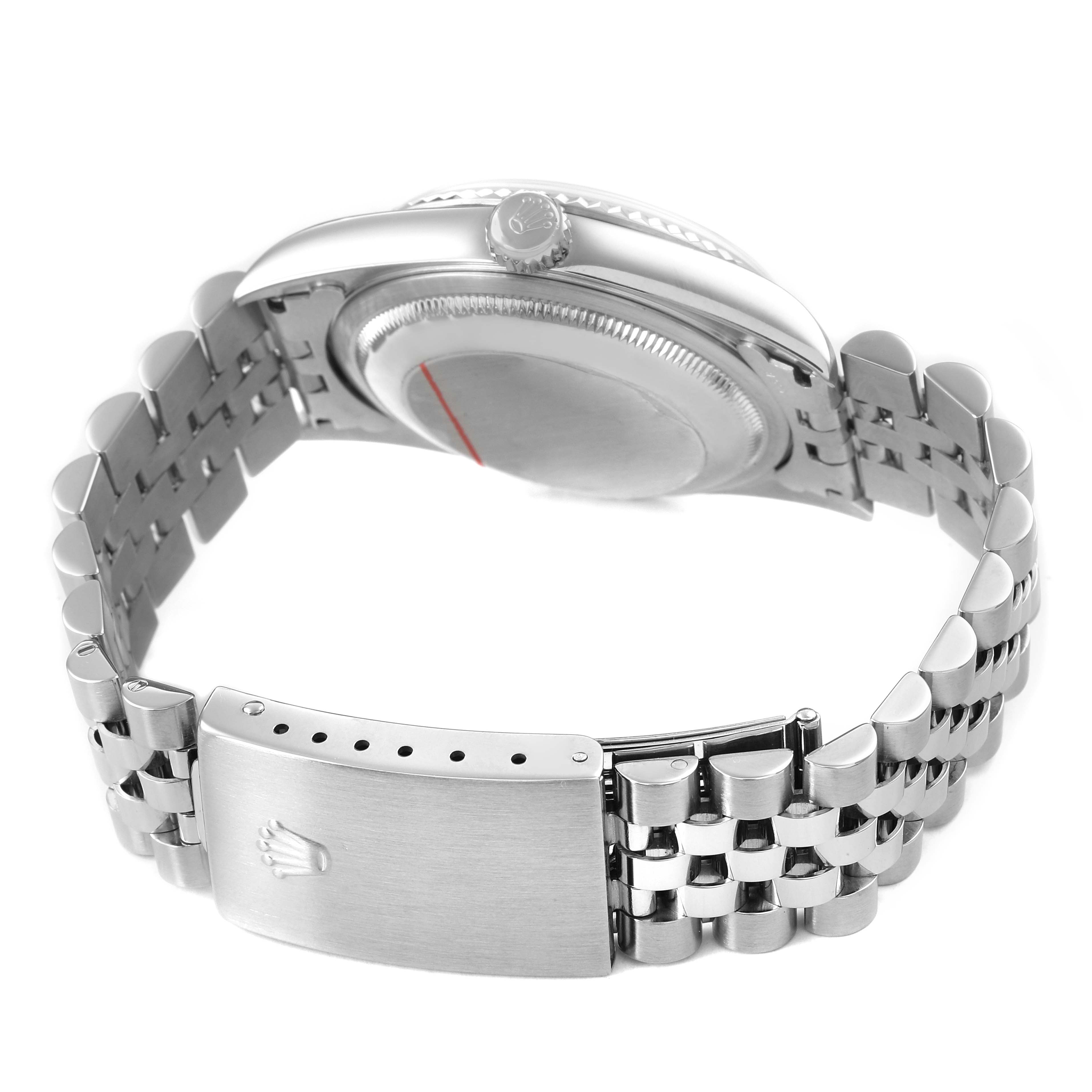 The Rolex Datejust 16234 Men's White Gold Silver Dial watch is shown from the side and back, highlighting the case, crown, bracelet, and clasp.