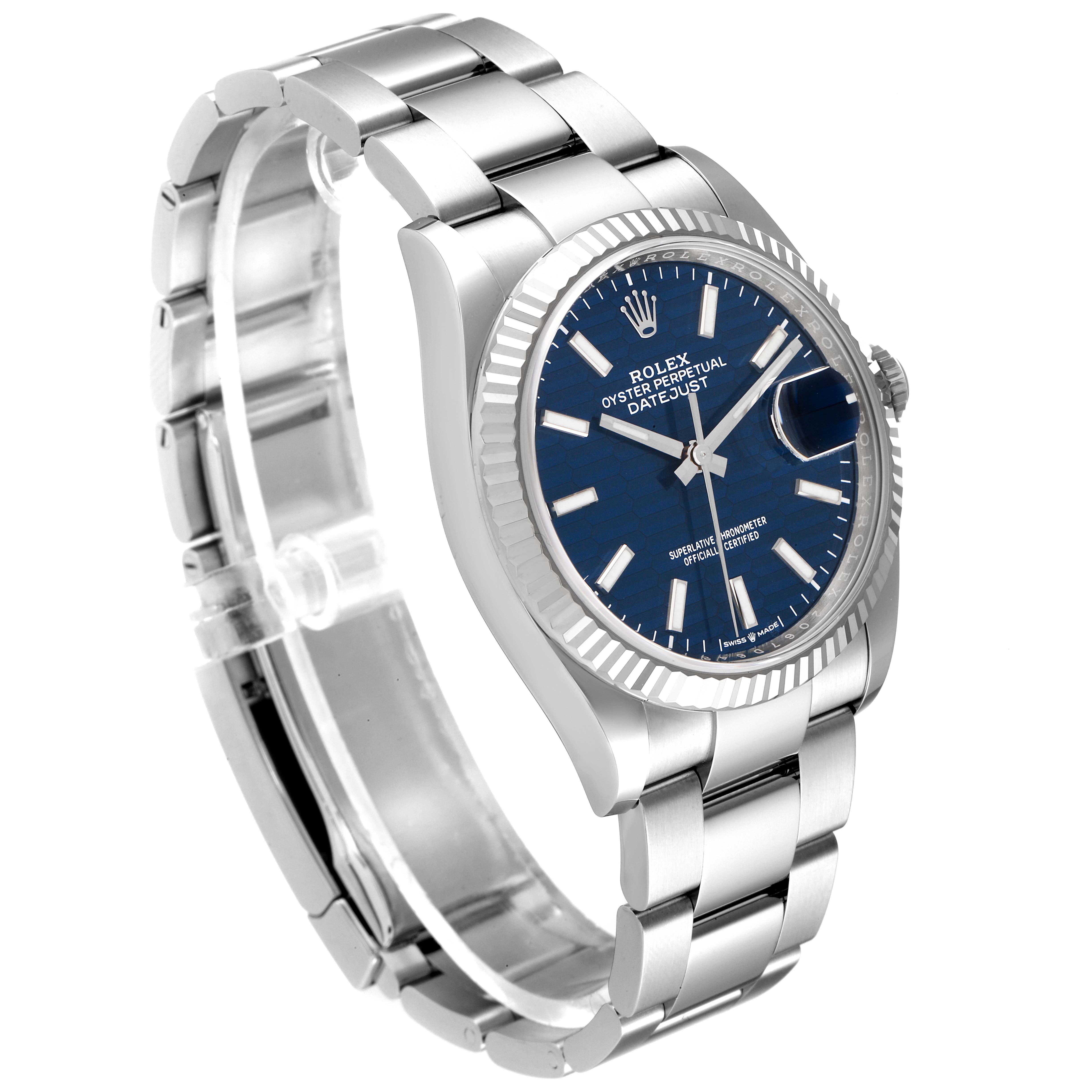 The image shows a Rolex Datejust 126234 Men
s Stainless Steel Blue Dial 126234 Men
s Stainless Steel Blue Dial watch from an angled view displaying its blue dial, bezel, and stainless steel bracelet.
