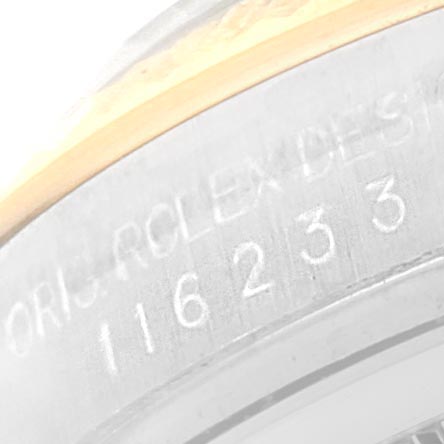 The image shows a close-up of the model number and serial engraving on the case side of a Rolex Datejust 116233 Men's Steel and Gold (two tone) Black Dial 116233 Men's Steel and Gold (two tone) Black Dial watch.