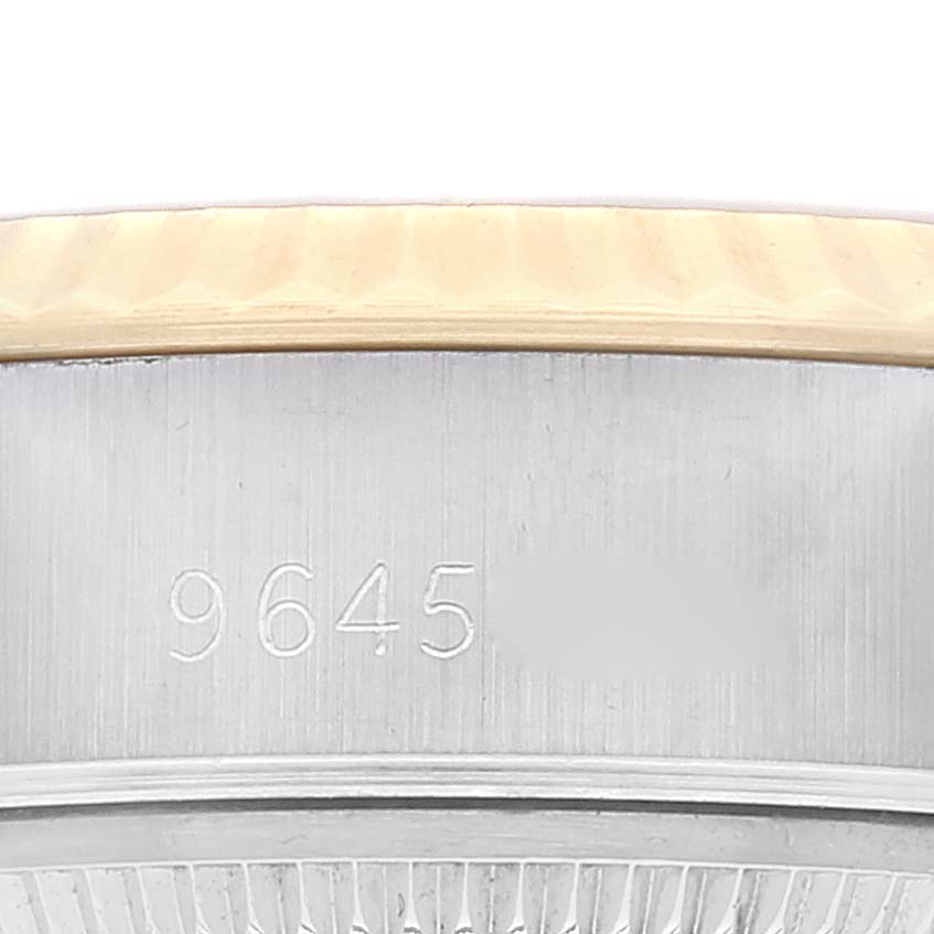 The image shows a partial close-up of the casing and serial number of a Rolex Datejust 69173 Women's Steel and Gold (two tone) Champagne Dial 69173 Women's Steel and Gold (two tone) Champagne Dial watch.