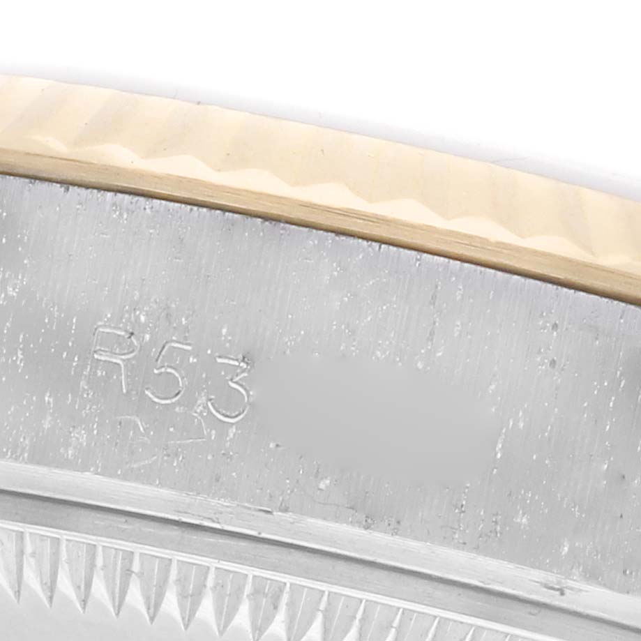 The image shows a close-up of the fluted bezel and case edge of a Rolex Datejust 69173 Women's Steel and Gold (two tone) Champagne Dial 69173 Women's Steel and Gold (two tone) Champagne Dial watch.