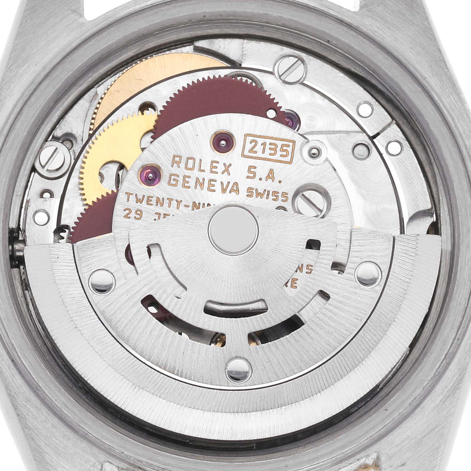 The image shows a close-up of the Rolex Datejust 69173 Women's Steel and Gold (two tone) Champagne Dial 69173 Women's Steel and Gold (two tone) Champagne Dial's movement, highlighting the rotor and gears from the back.