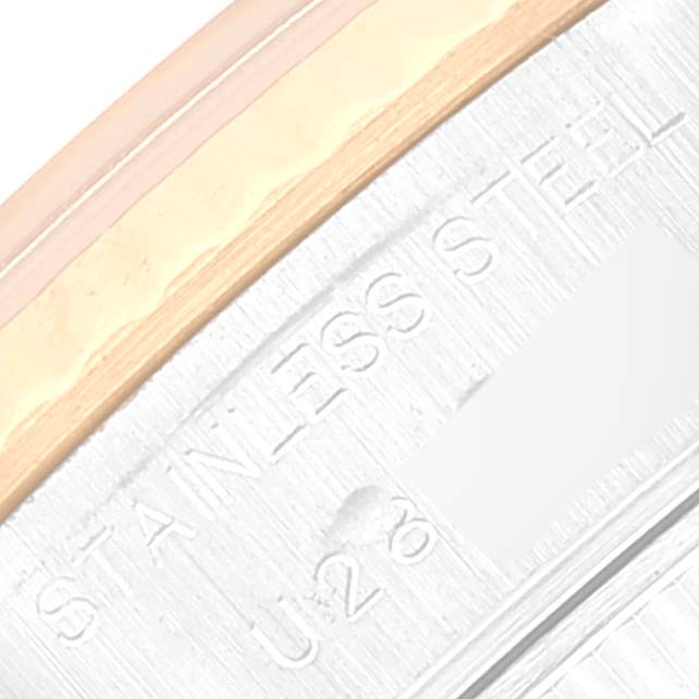 This close-up angle of the Rolex Datejust 69173 Women's Steel and Gold (two tone) Champagne Dial 69173 Women's Steel and Gold (two tone) Champagne Dial watch focuses on the case rim, showing "STAINLESS STEEL" engraving.