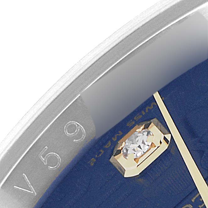 The image shows a close-up of a Rolex Datejust 116243 Men's Steel and Gold (two tone) Blue Dial 116243 Men's Steel and Gold (two tone) Blue Dial watch, highlighting part of the dial, bezel, and diamond hour marker.