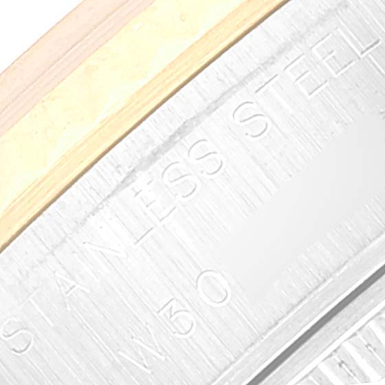 This close-up image shows part of the band and case back of a Rolex Datejust 69173 Women's Steel and Gold (two tone) Beige Dial 69173 Women's Steel and Gold (two tone) Beige Dial, highlighting "Stainless Steel" engraving.