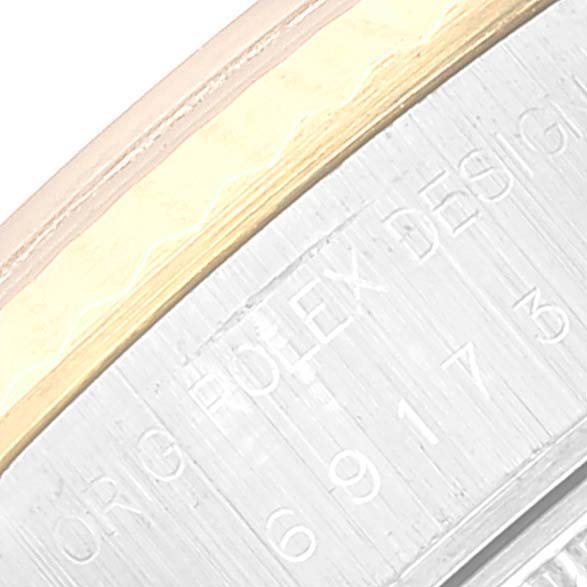 The image shows a detailed close-up of the engraved edge of a Rolex Datejust 69173 Women's Steel and Gold (two tone) Beige Dial 69173 Women's Steel and Gold (two tone) Beige Dial watch bezel.