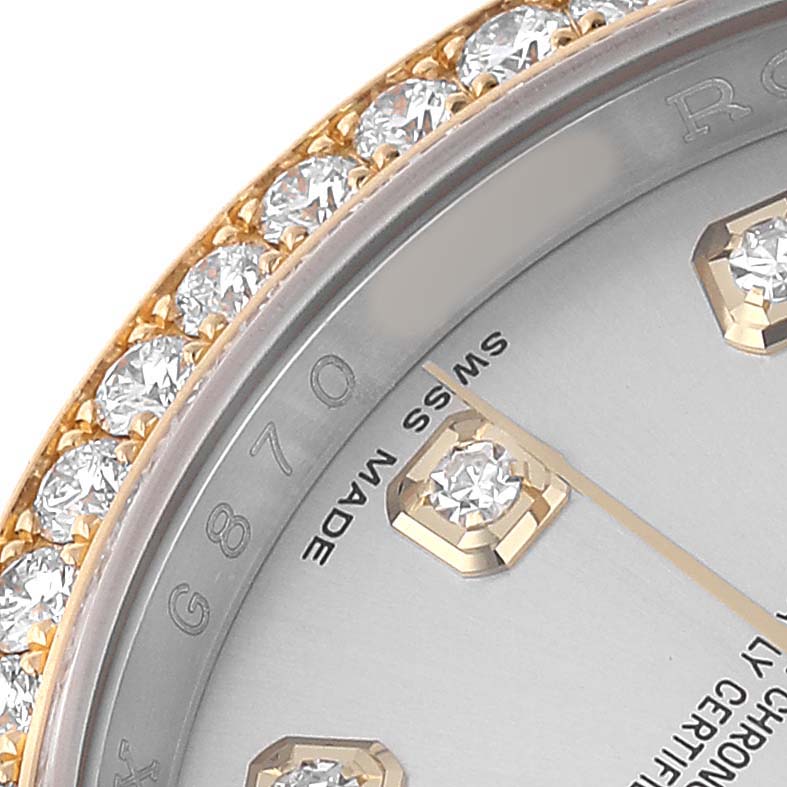 The image shows a close-up of the Rolex Datejust 116243 Men's Steel and Gold (two tone) Silver Dial watch showcasing part of the dial, diamond hour markers, and diamond-set bezel.