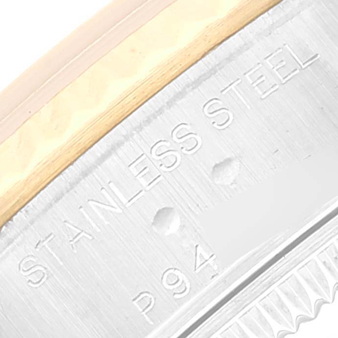 This image shows a close-up of the side of a Rolex Datejust 79173 Women's Steel and Gold (two tone) Grey Dial 79173 Women's Steel and Gold (two tone) Grey Dial watch, highlighting the "STAINLESS STEEL" engraving.