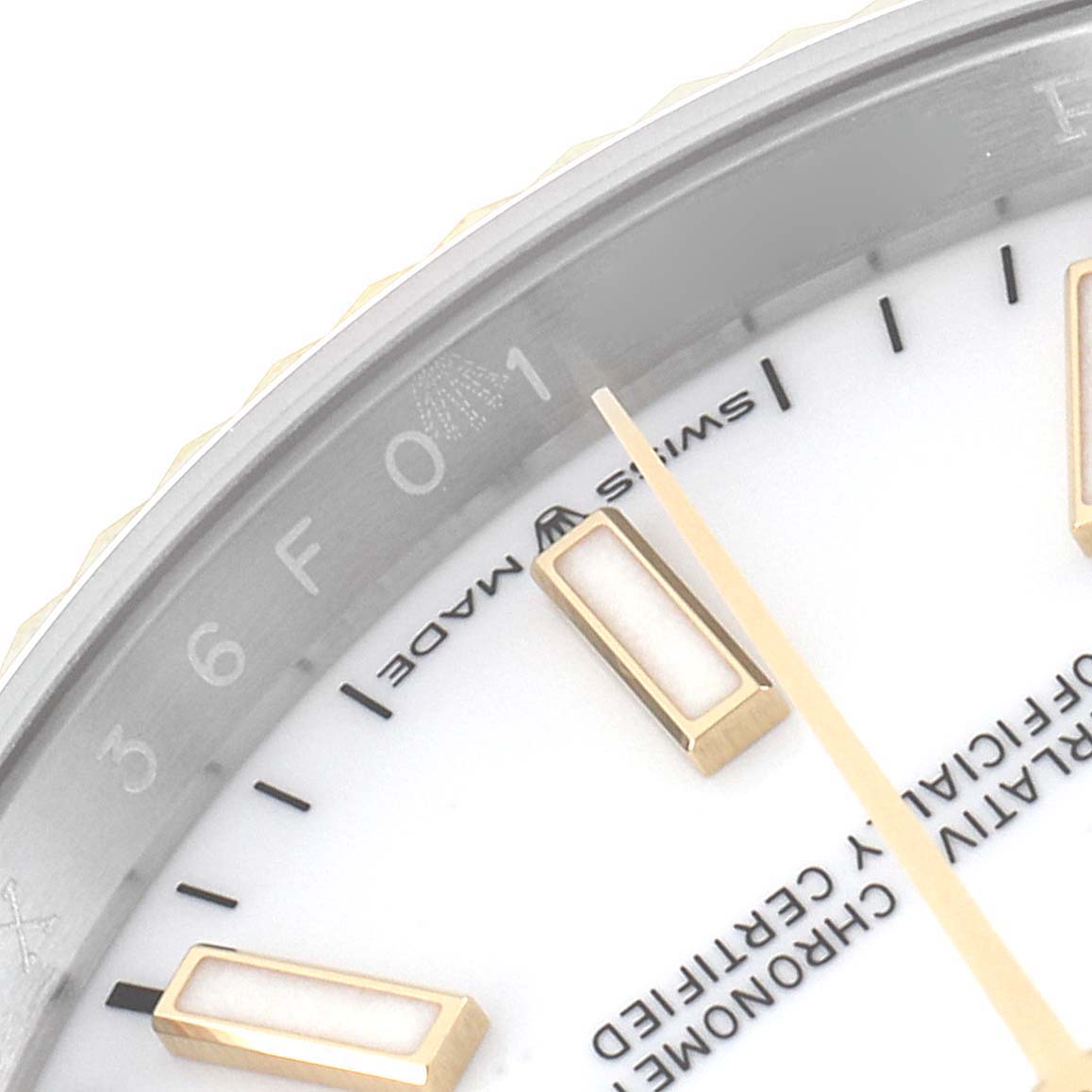 This image shows a close-up of the dial and part of the bezel of a Rolex Datejust 126233 Men's Steel and Gold (two tone) White Dial 126233 Men's Steel and Gold (two tone) White Dial watch, highlighting the hour markers and Swiss Made text.