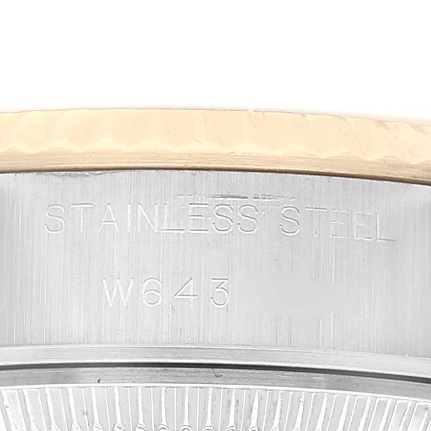 This image shows a close-up of the stainless steel engraving and serial number on the side of a Rolex Datejust 69173 Women's Steel and Gold (two tone) White Dial 69173 Women's Steel and Gold (two tone) White Dial watch case.