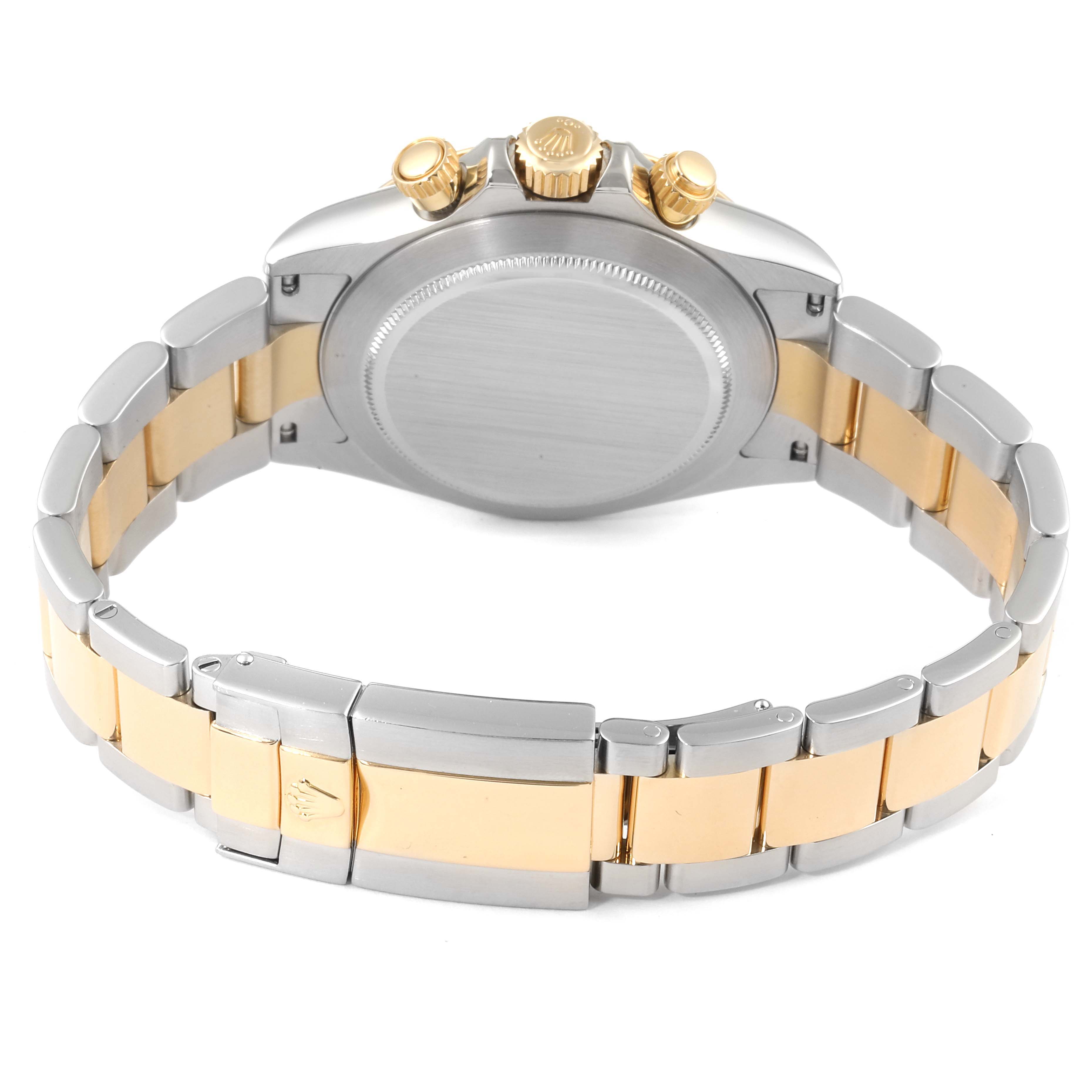 The image shows the back of a Rolex Daytona 116523 Men's Steel and Gold (two tone) Black Dial 116523 Men's Steel and Gold (two tone) Black Dial watch, focusing on the case back, bracelet, and clasp.