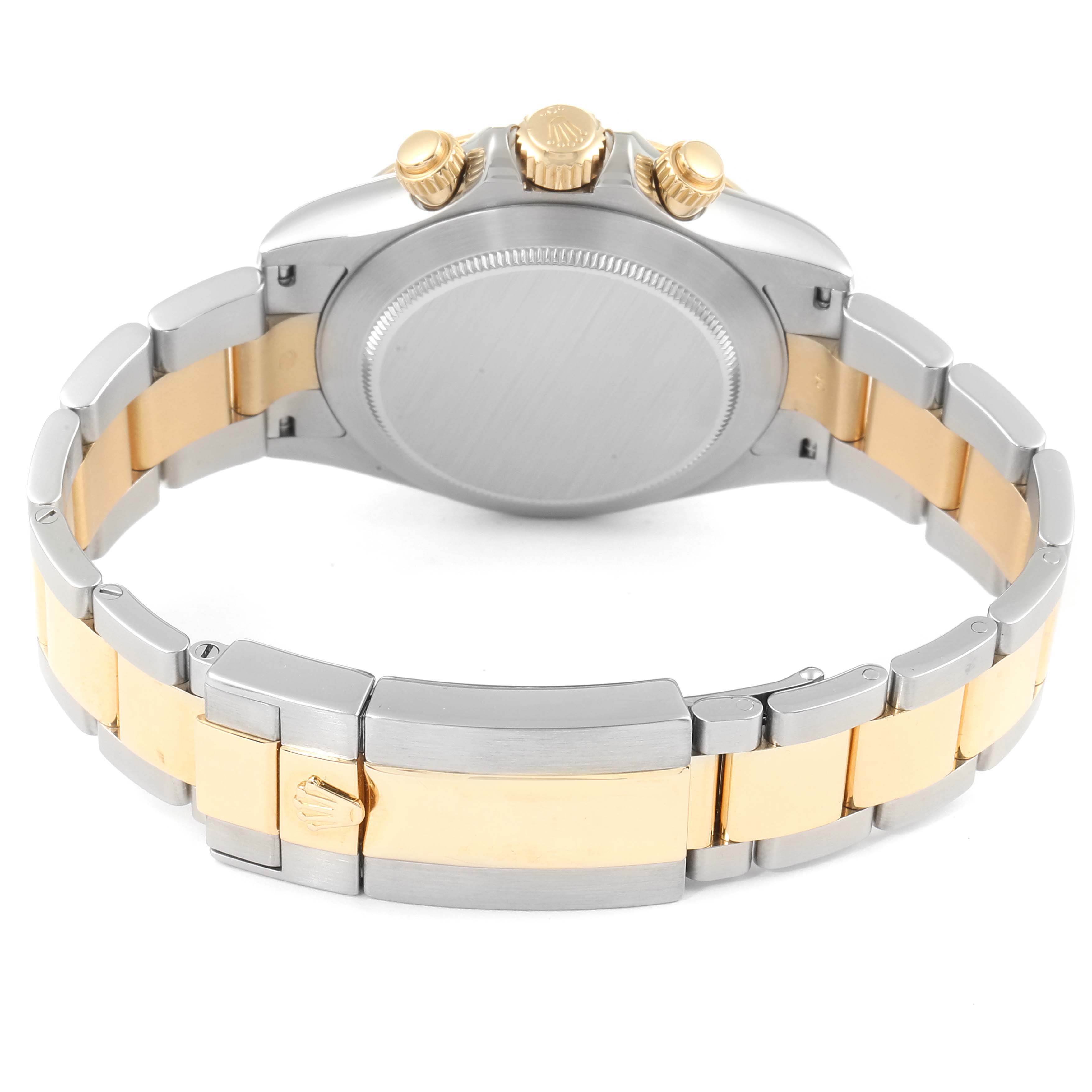 The image shows the back case and clasp of a Rolex Daytona 116523 Men
s Steel and Gold (two tone) Blue Dial 116523 Men
s Steel and Gold (two tone) Blue Dial watch, highlighting its metal and gold two-tone bracelet.