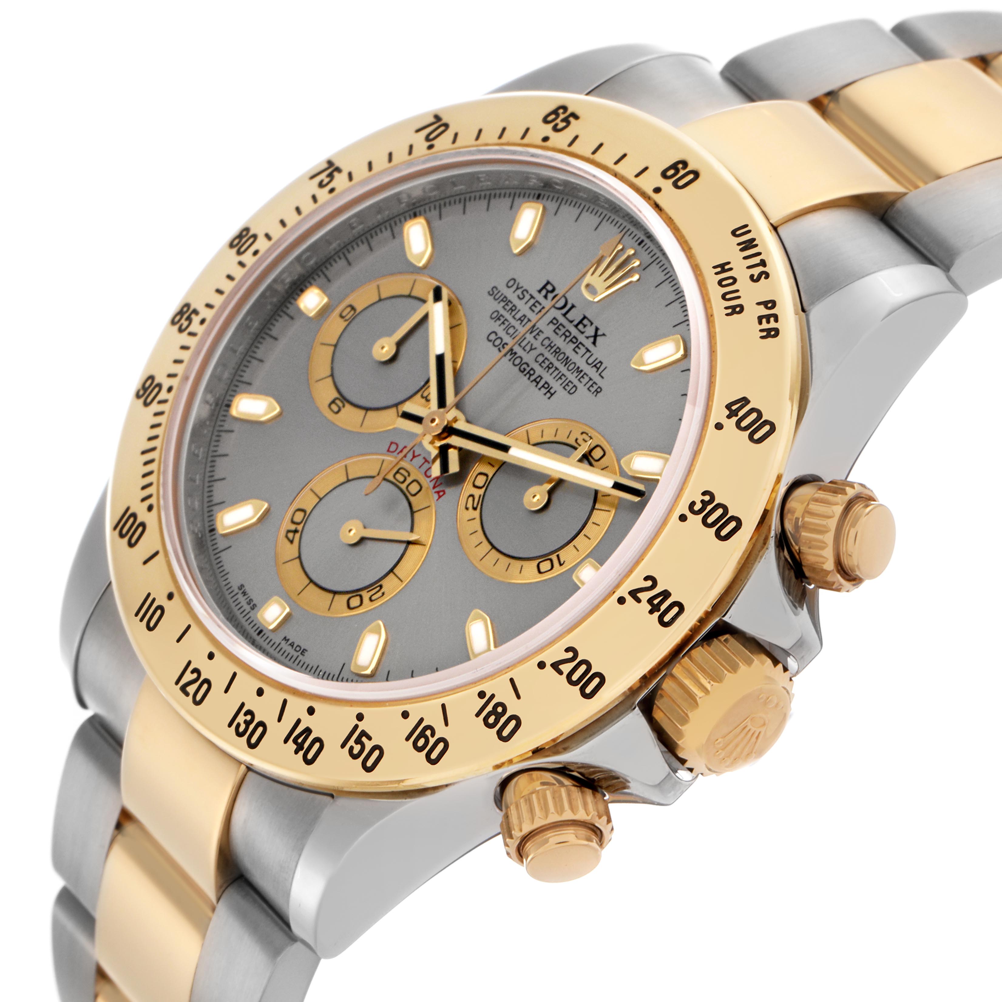 The Rolex Daytona 116523 Men's Steel and Gold (two tone) Grey Dial 116523 Men's Steel and Gold (two tone) Grey Dial watch is shown at an angle, highlighting the bezel, dial, crown, and part of the bracelet.