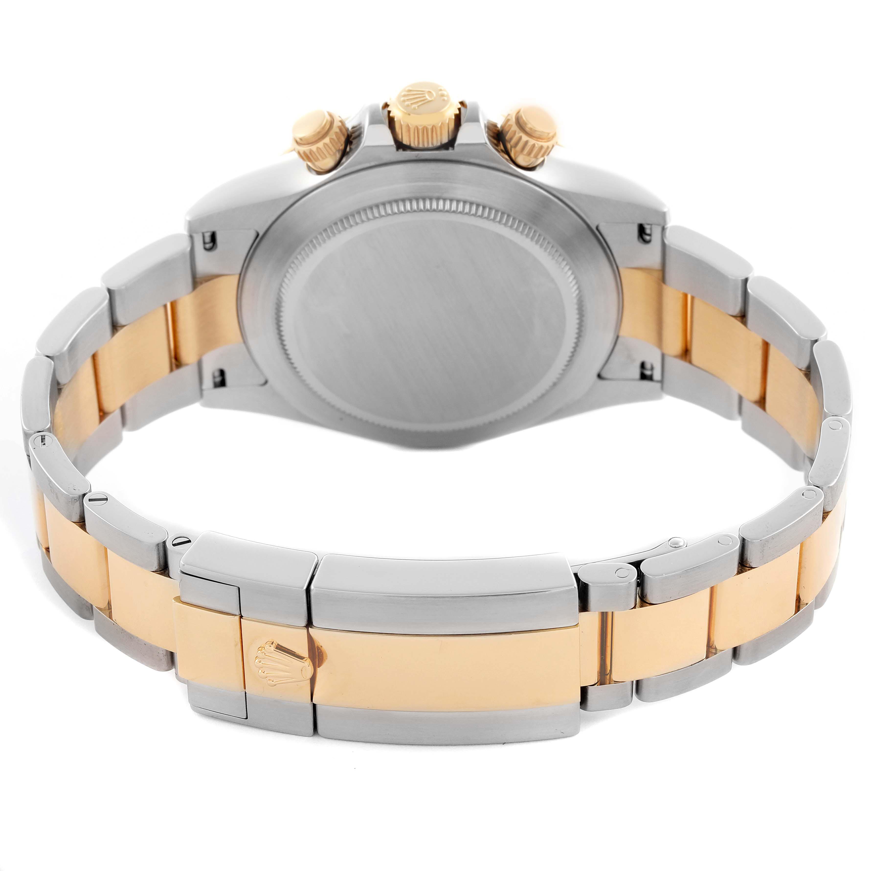 The Rolex Daytona 116523 Men's Steel and Gold (two tone) Grey Dial 116523 Men's Steel and Gold (two tone) Grey Dial watch is shown from the back, highlighting the bracelet, clasp, case back, and crown.